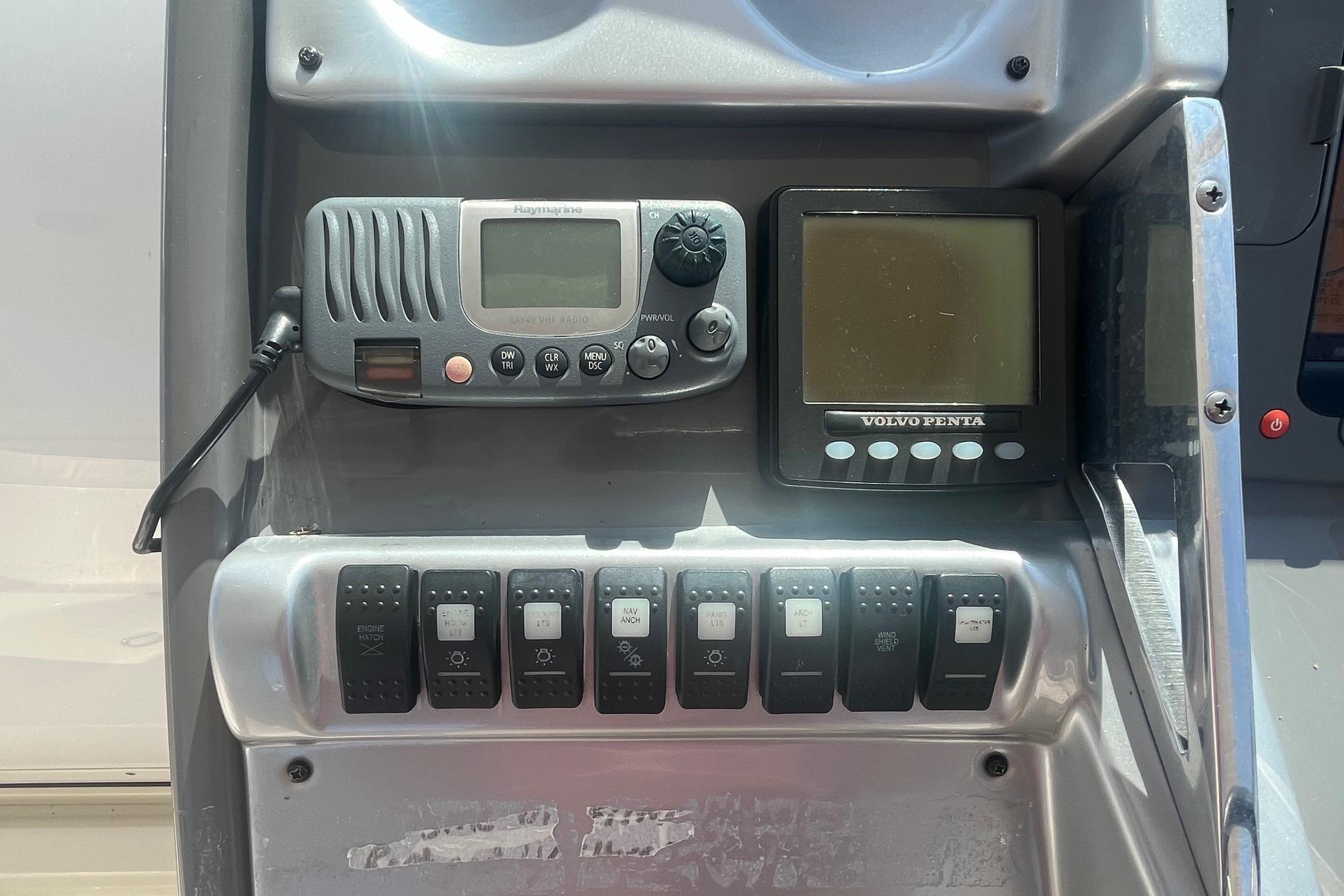 Control panel of a 2010 Monterey 400 Sport Yacht with radio and Volvo Penta display.