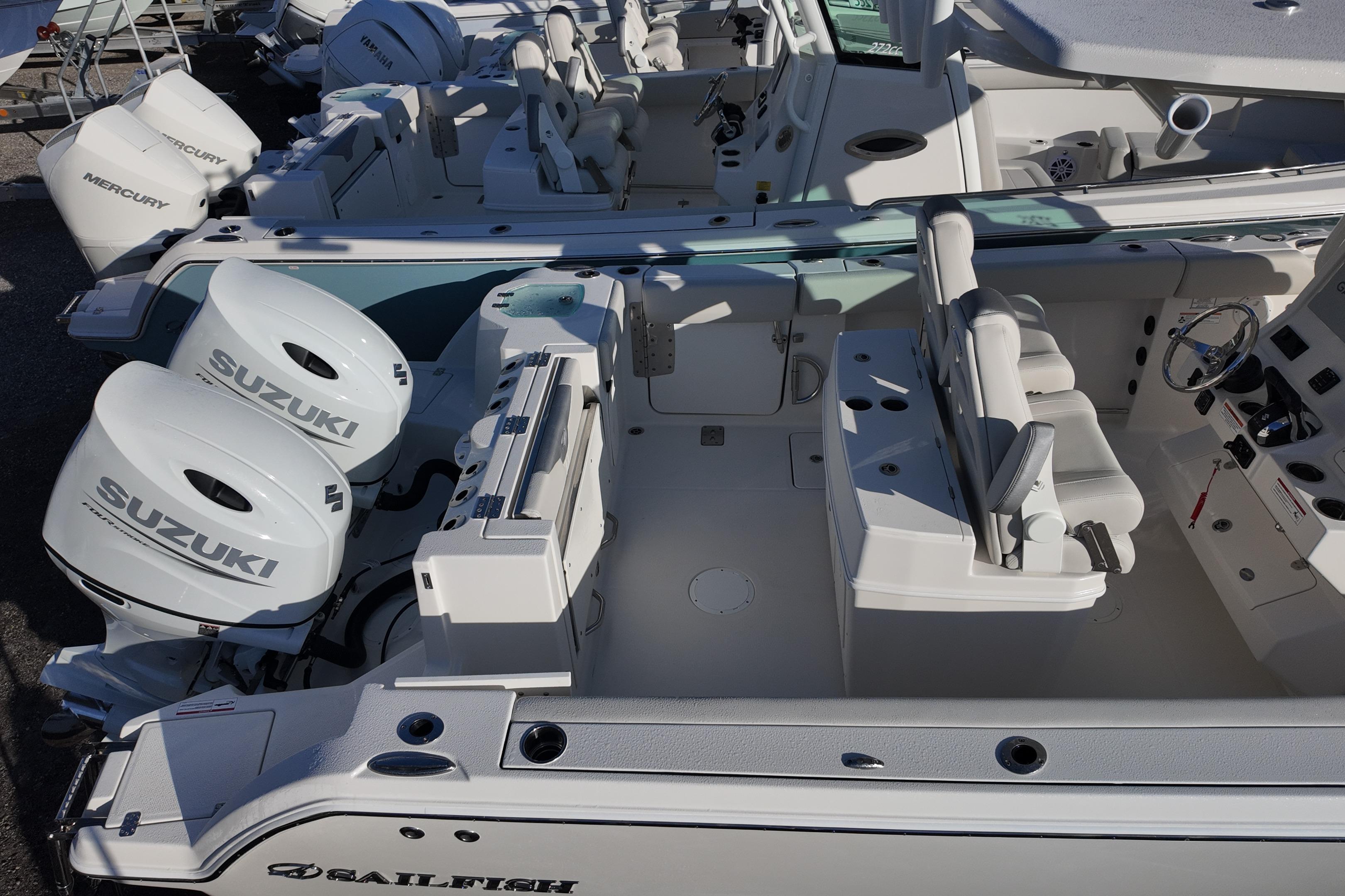 2026 Sailfish 272 CC boat with dual Suzuki outboard engines, featuring a spacious cockpit and seating.