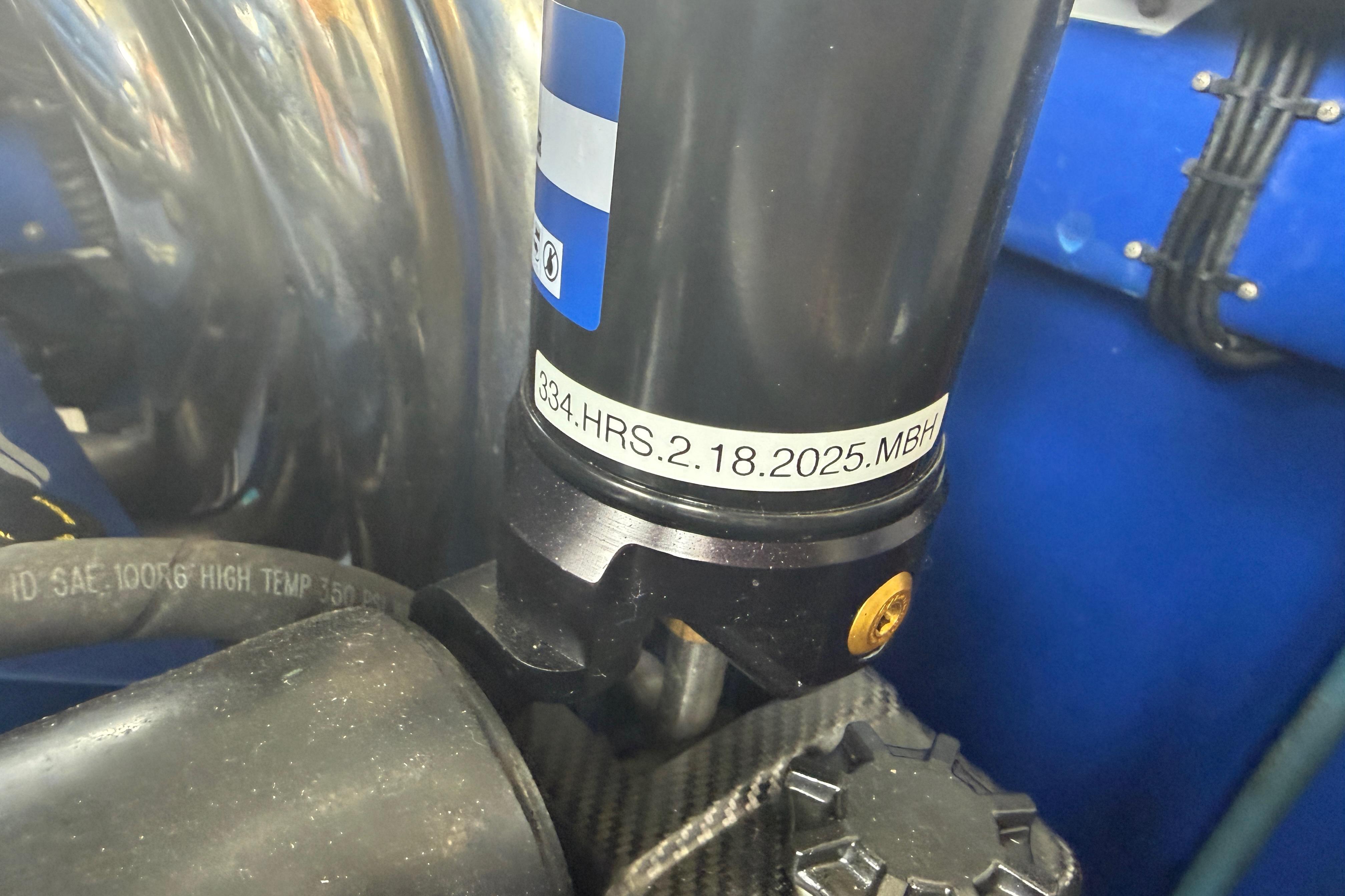 Close-up of Nor-Tech 477 SPX Vee Bottom 2013 engine component with label details.