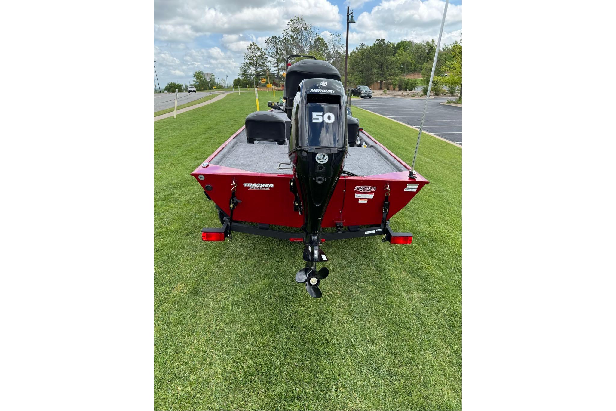 2026 Tracker Bass Tracker Classic XL boat with Mercury engine on grass.