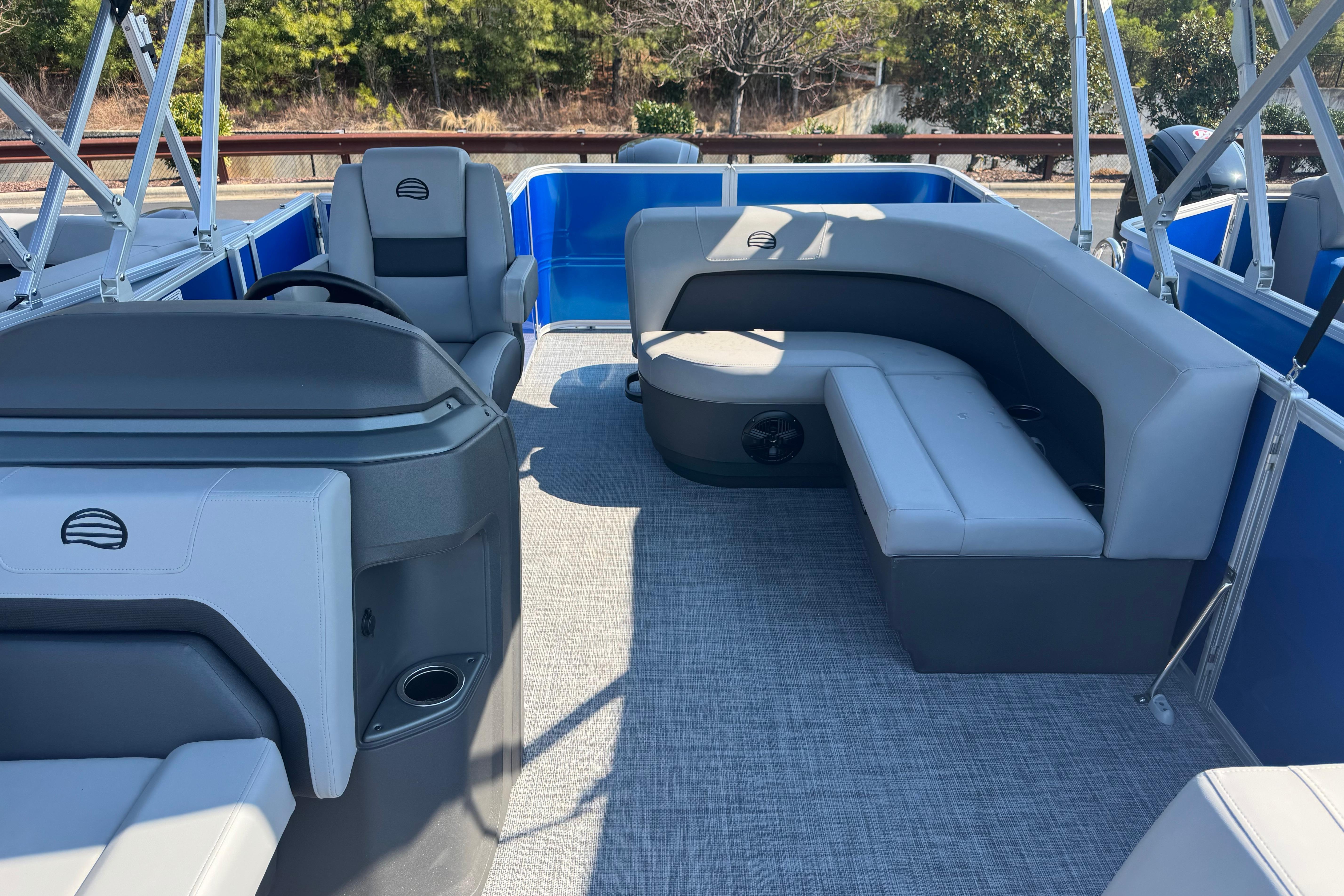 2026 Sun Tracker Party Barge 18 DLX interior with gray seating and modern design.