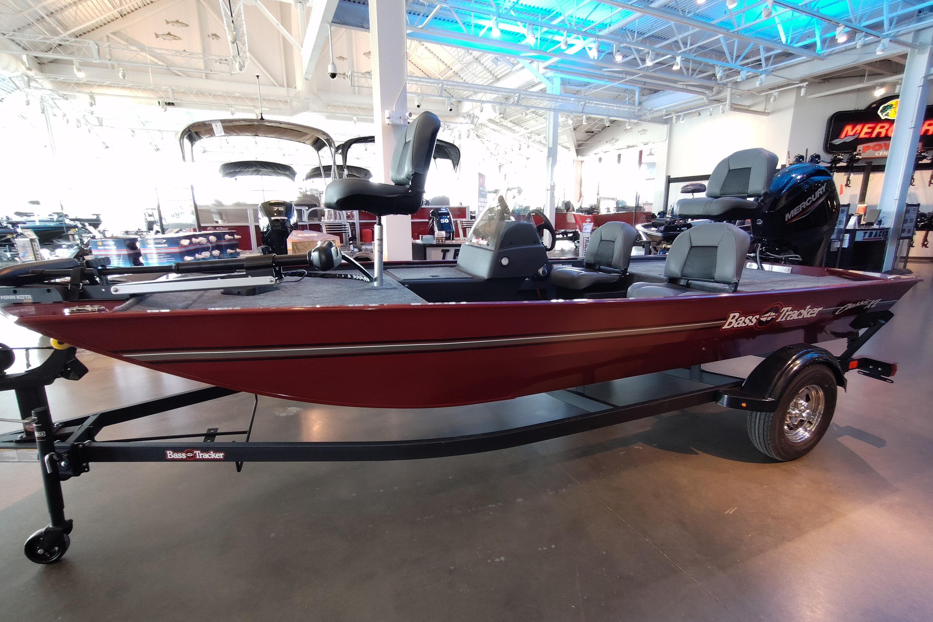 2026 Tracker Bass Tracker Classic XL boat in showroom, featuring sleek design and modern amenities.