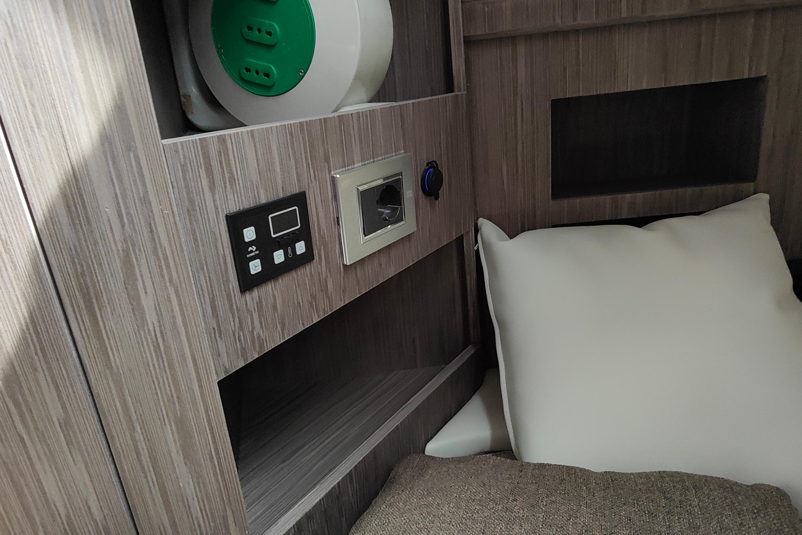 Interior of 2022 Ranieri International CAYMAN 45 CRUISER with control panel and cushions.