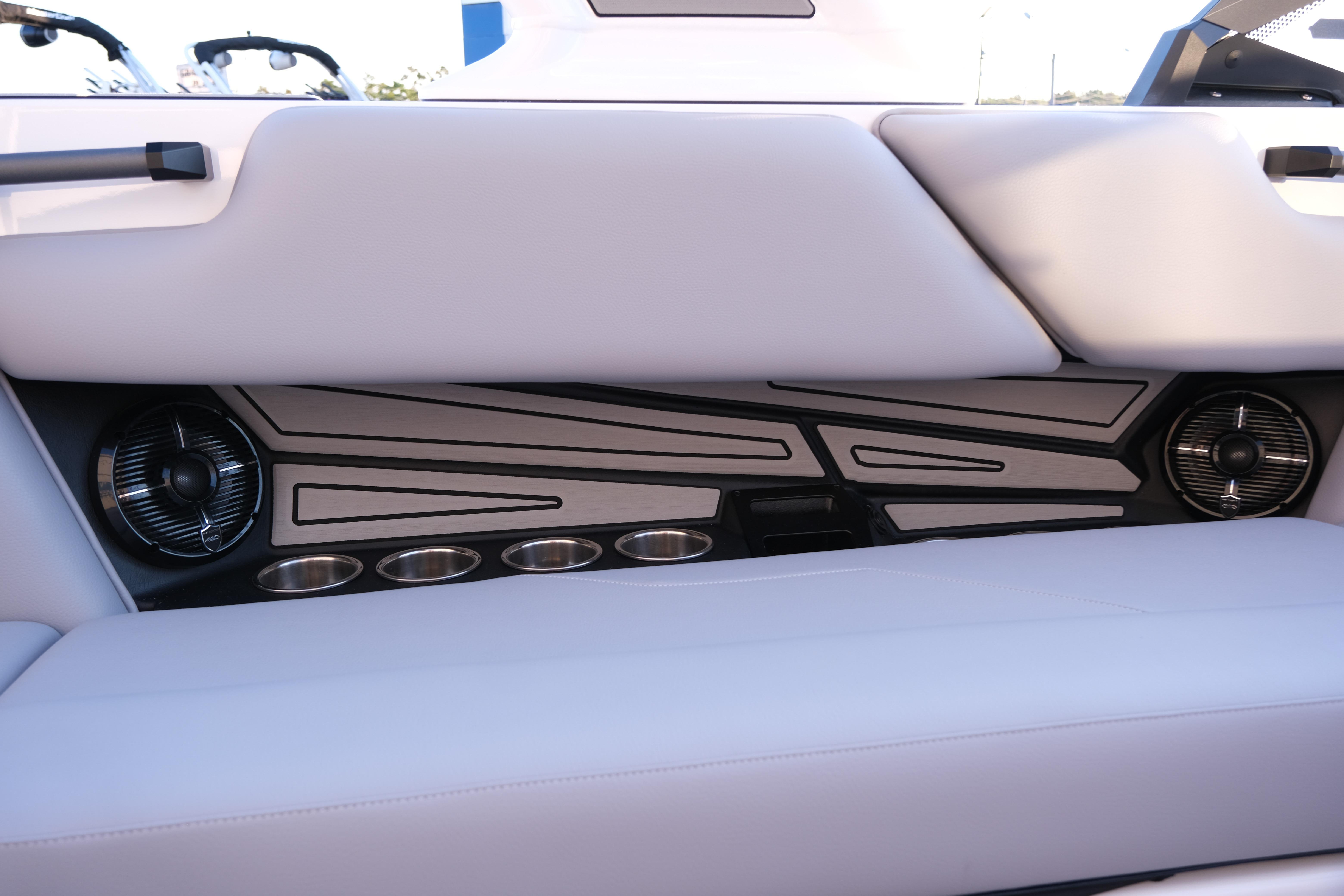 2026 Moomba Max boat interior with sleek seating, cup holders, and integrated speakers.