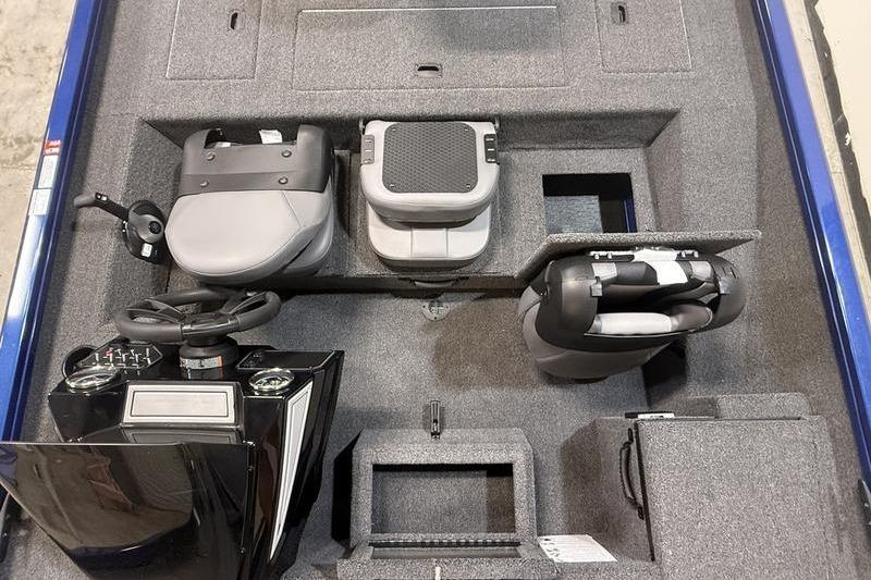 2026 Lowe Stinger 175C boat interior with seating and steering console.