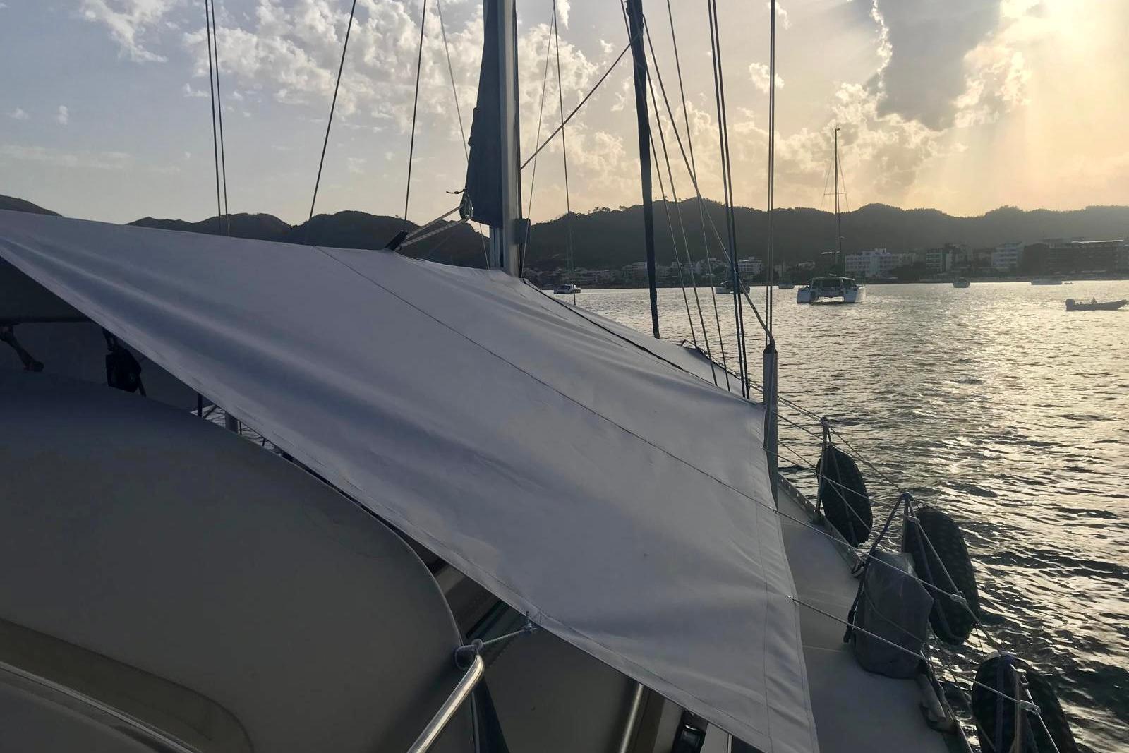 Jeanneau Sun Odyssey 45.1 sailboat anchored at sunset, 1995 model.