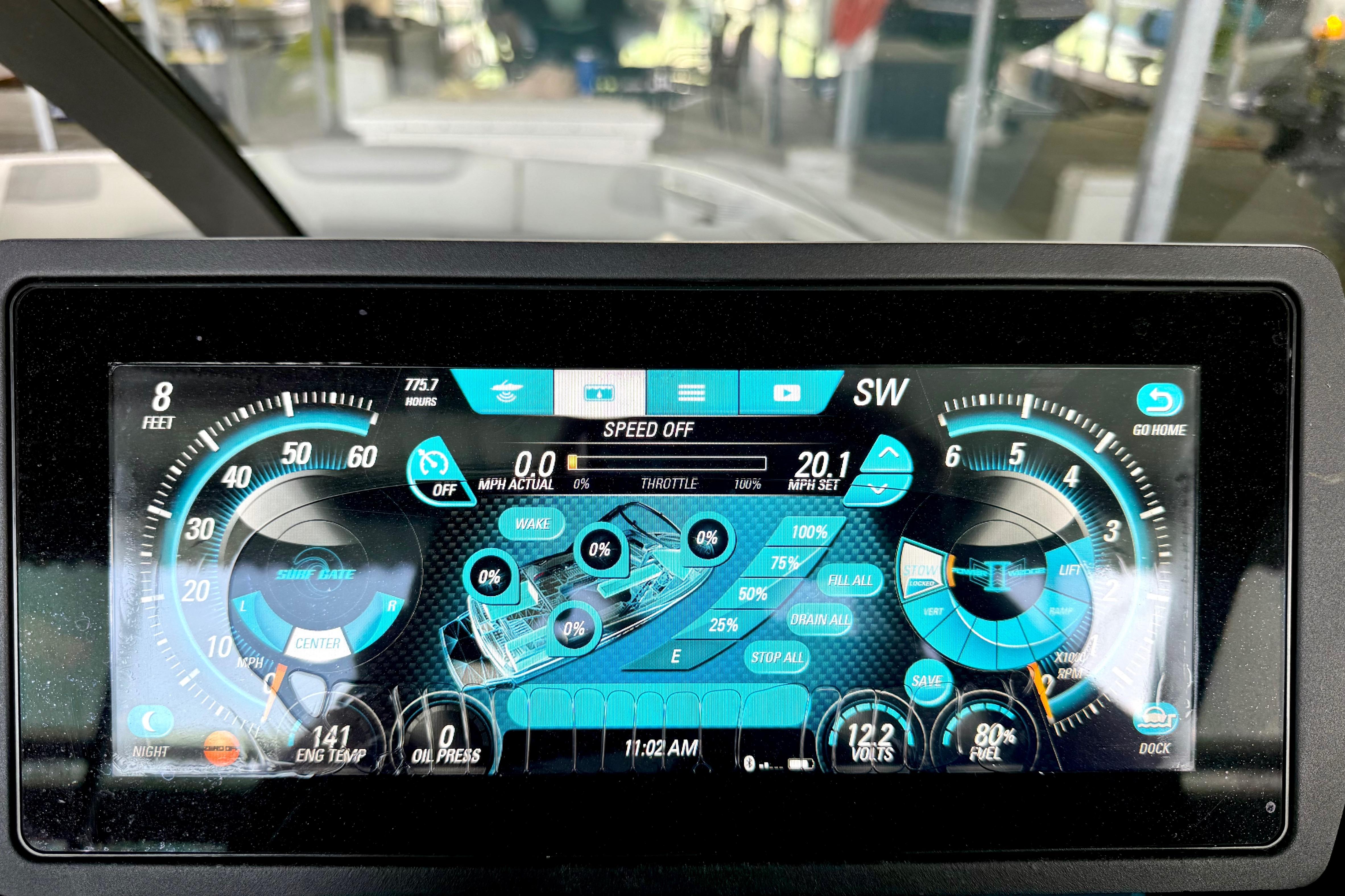 Dashboard display of a 2017 Malibu M235 boat with speed and system controls.