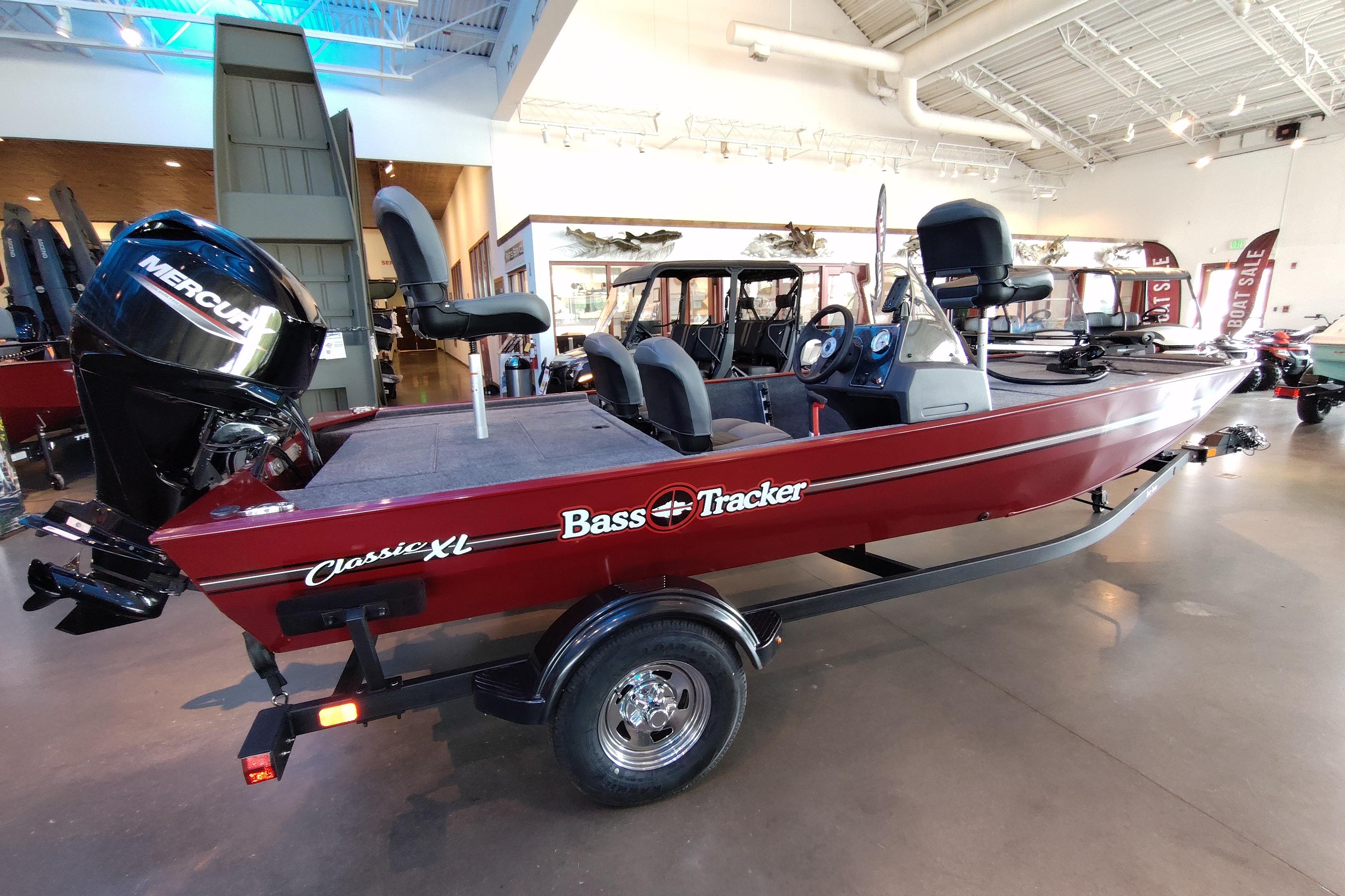 2026 Tracker Bass Tracker Classic XL boat in showroom, featuring Mercury engine.