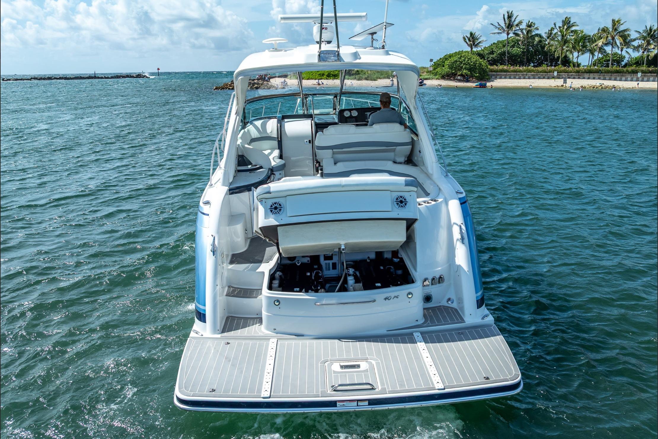 2022 Formula 40 Performance Cruiser on water, rear view, open engine compartment.