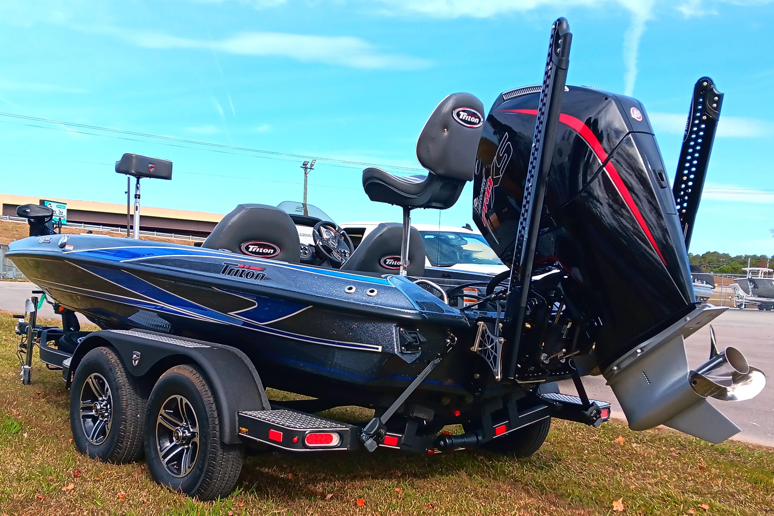 2026 Triton 18 TrX bass boat with powerful outboard motor on a trailer.