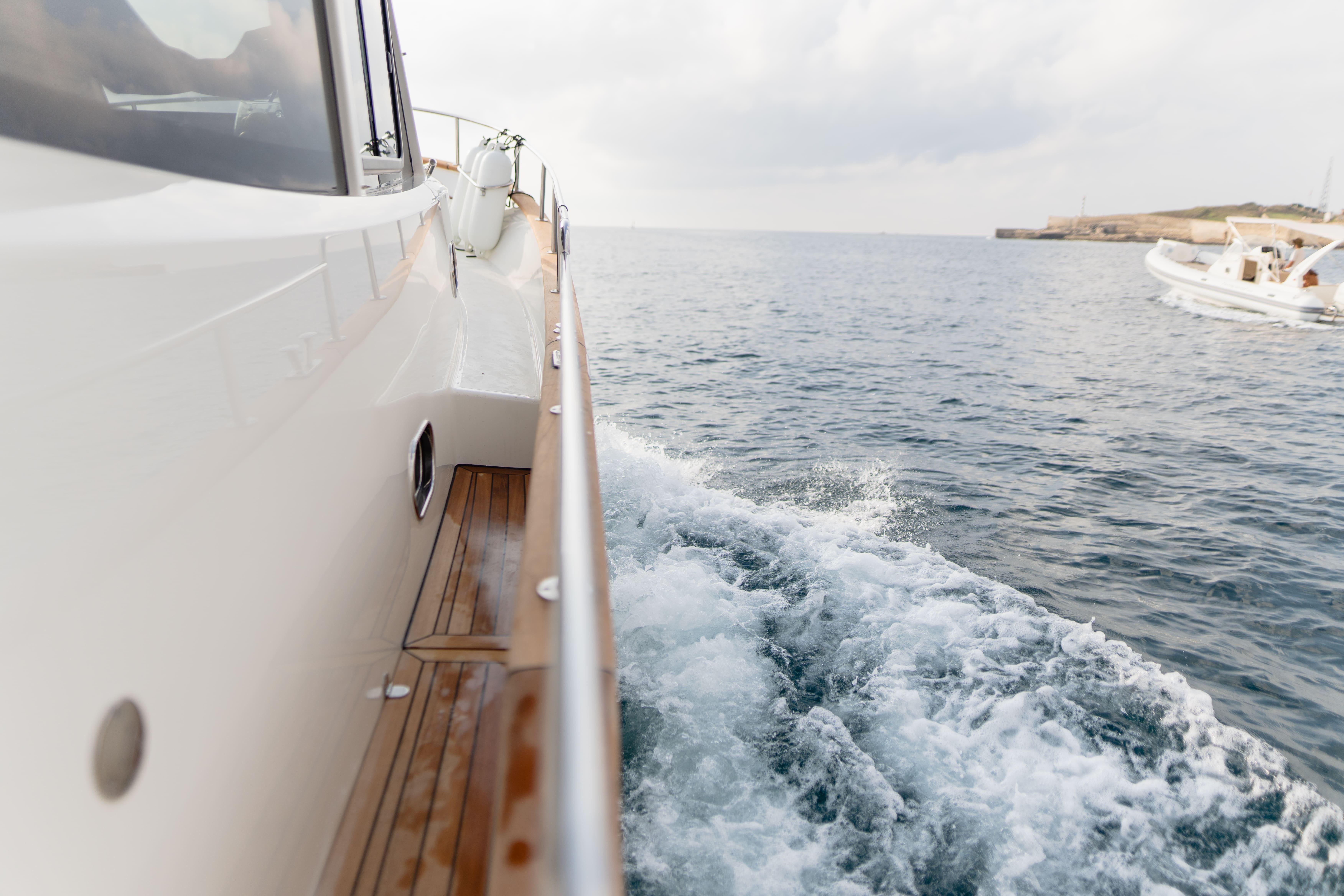 2024 Sasga Yachts Menorquin 35 HT cruising on open water, side view.