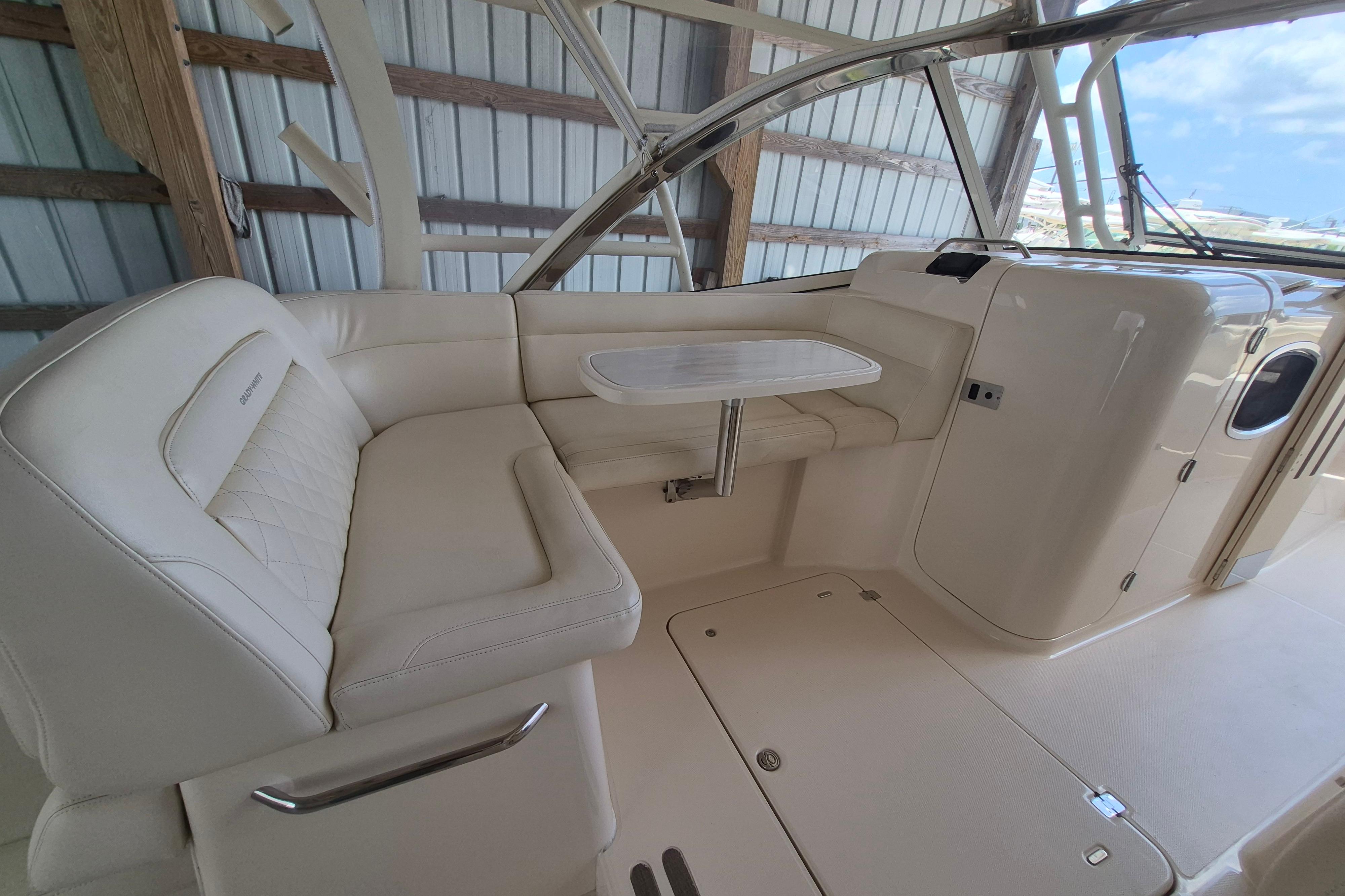 2019 Grady-White Freedom 335 boat interior with white seating and table.