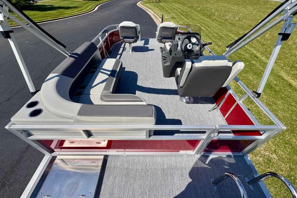 2026 Sun Tracker Bass Buggy 16 XL Select pontoon boat with spacious seating and modern helm.
