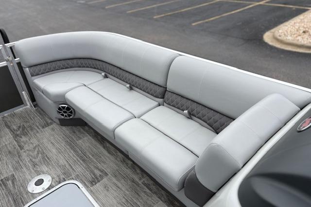 2025 Ranger Reata 243C boat interior with gray cushioned seating and modern design.