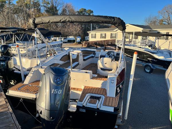 2024 Starcraft SVX 191 boat with Yamaha 150 outboard motor at a marina.