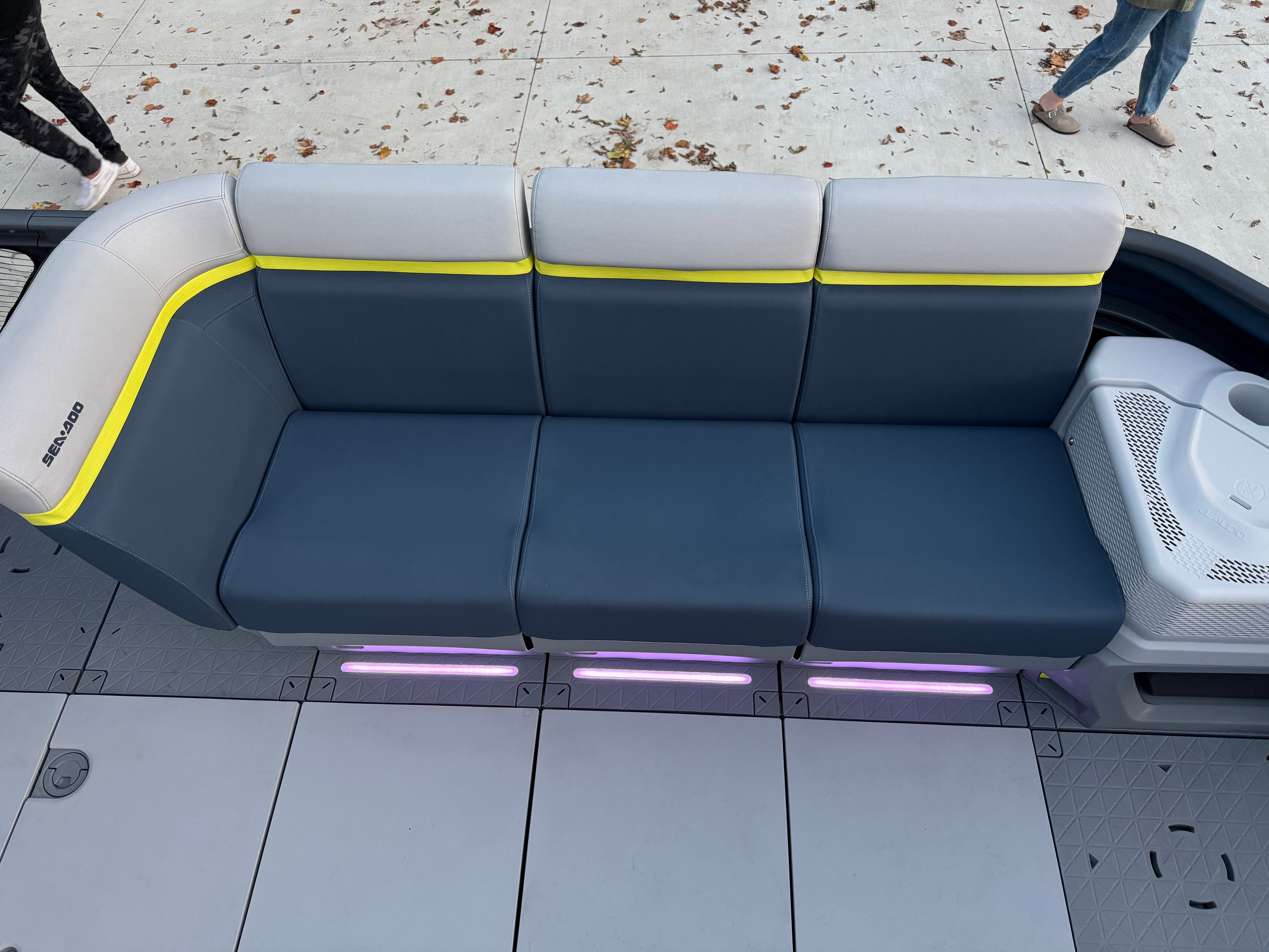 The 2025 Sea-Doo Switch Cruise Limited 21 features a modern bench with blue and gray upholstery.