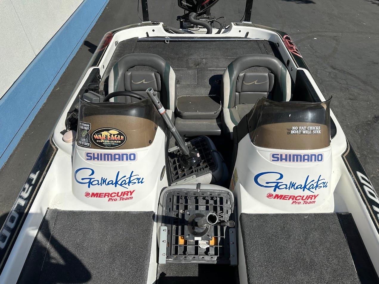 1999 Fisher 21 FX DC boat interior with Shimano and Gamakatsu branding.