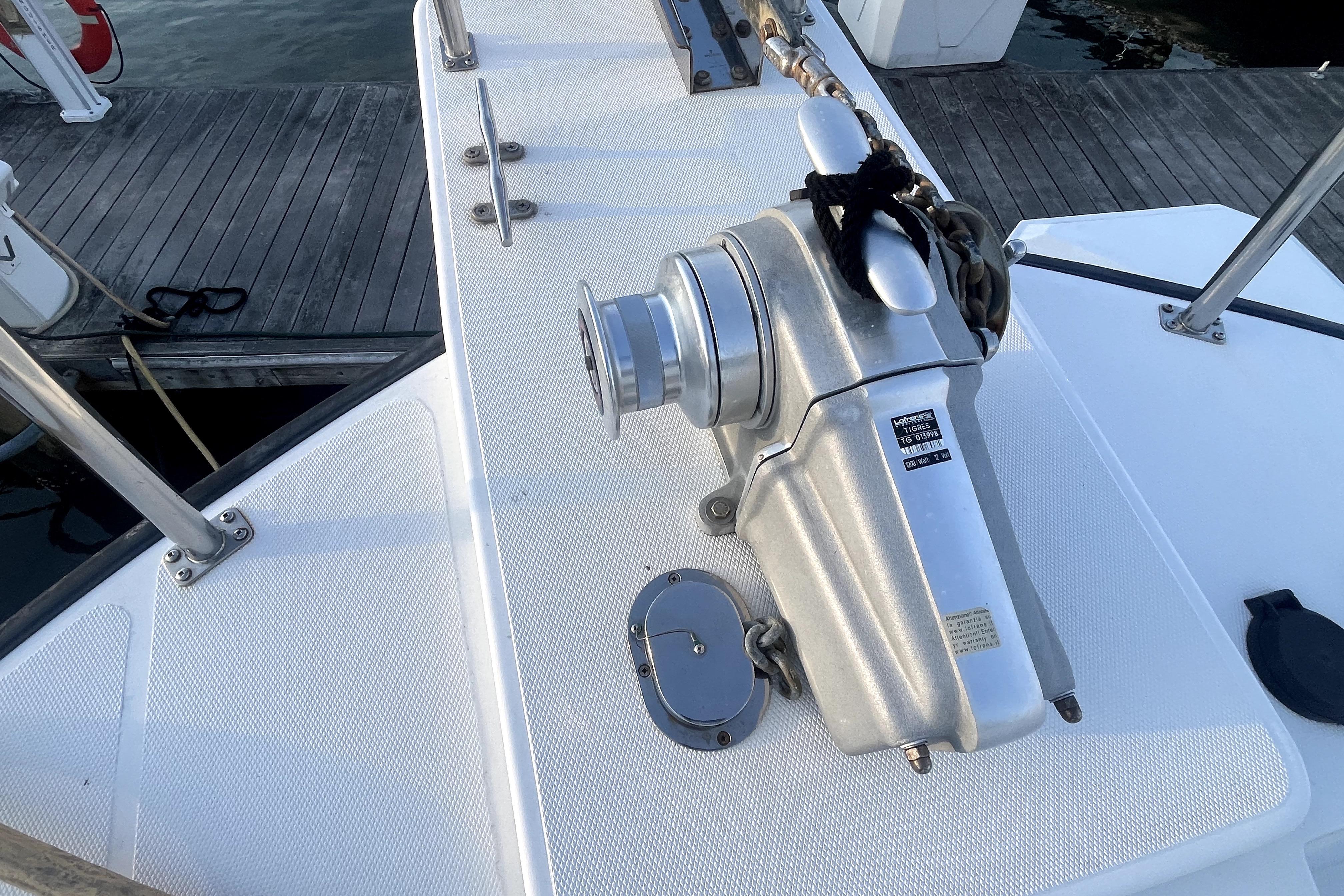 Nordic Tug 42 (2008) deck with anchor windlass and chain, dockside view.