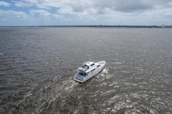 2001 Grand Harbour 76 yacht cruising on open water under a cloudy sky