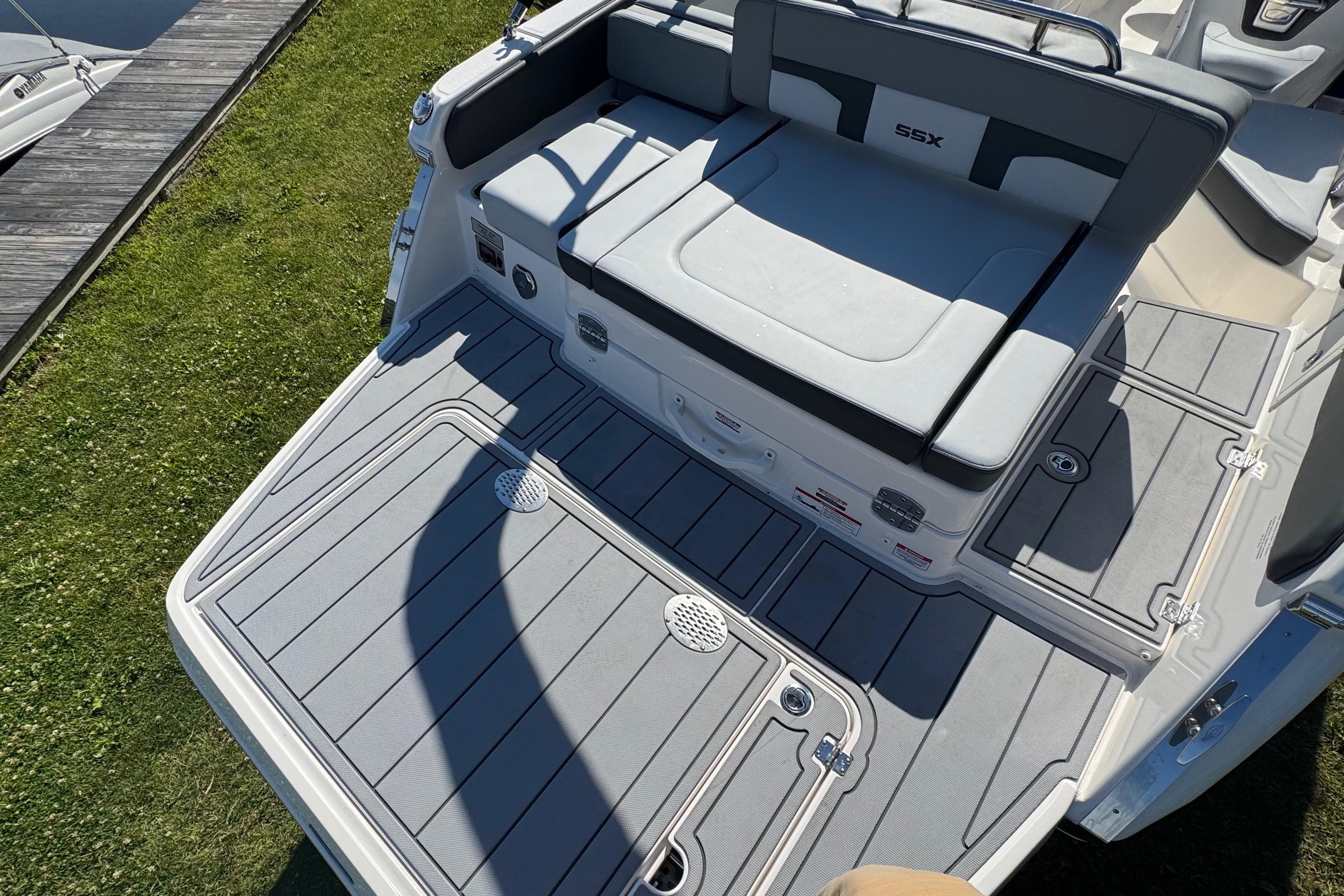2026 Chaparral SSX 4 boat deck with cushioned seating and sleek design.