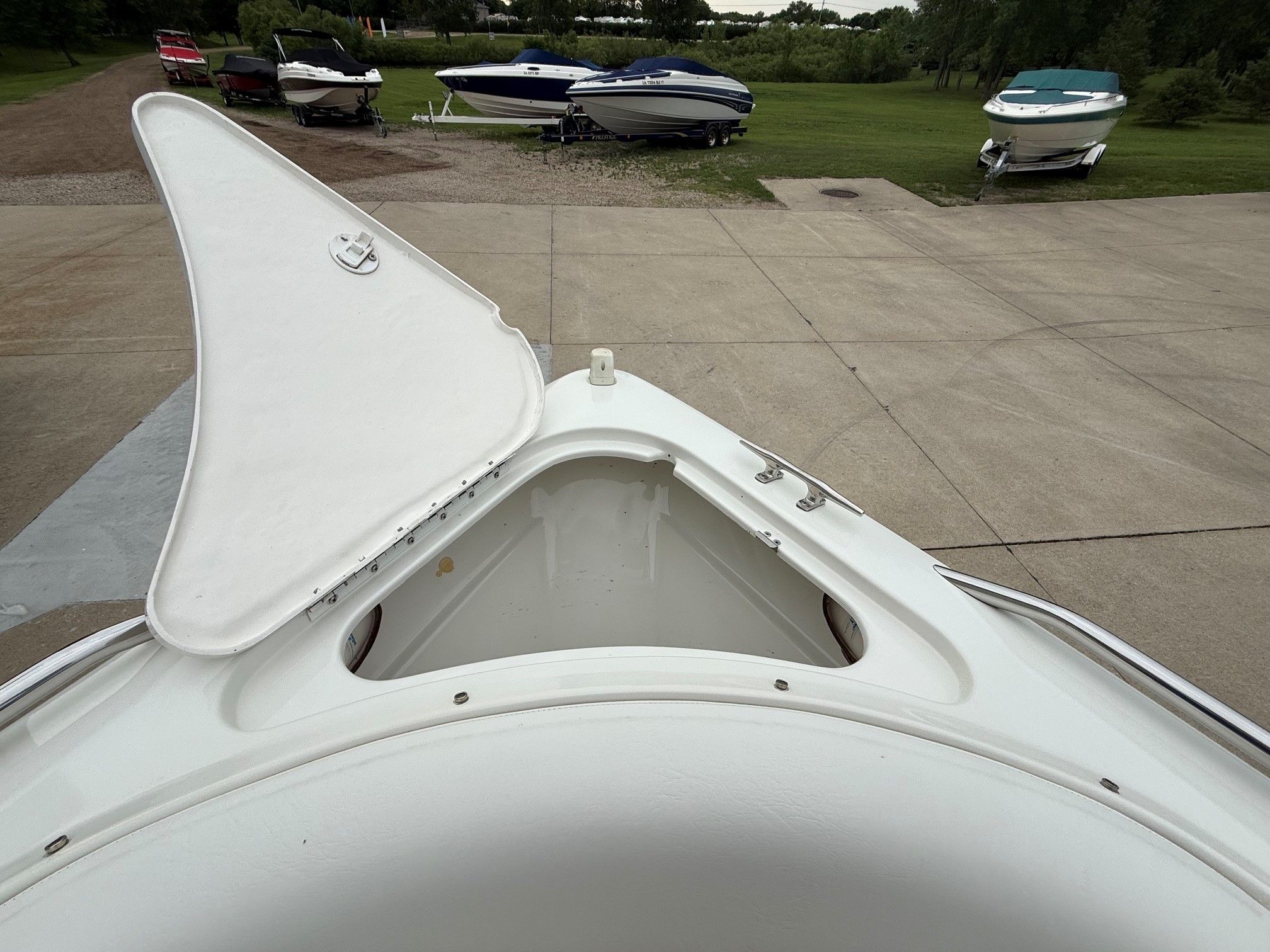 1998 Formula Thunderbird boat on a parking lot.