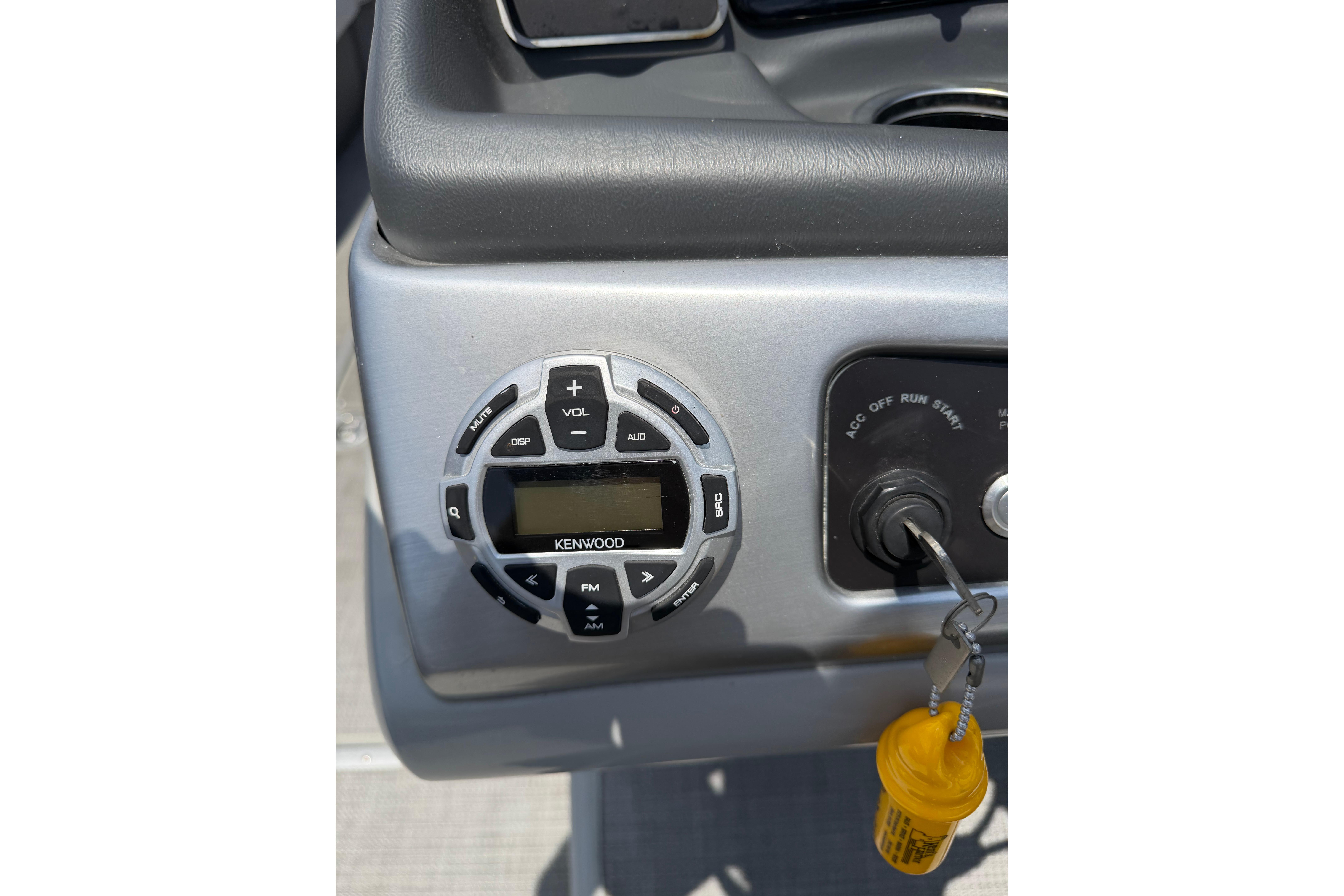 Control panel of a 2019 Regency 230 DL3 boat with Kenwood audio system.