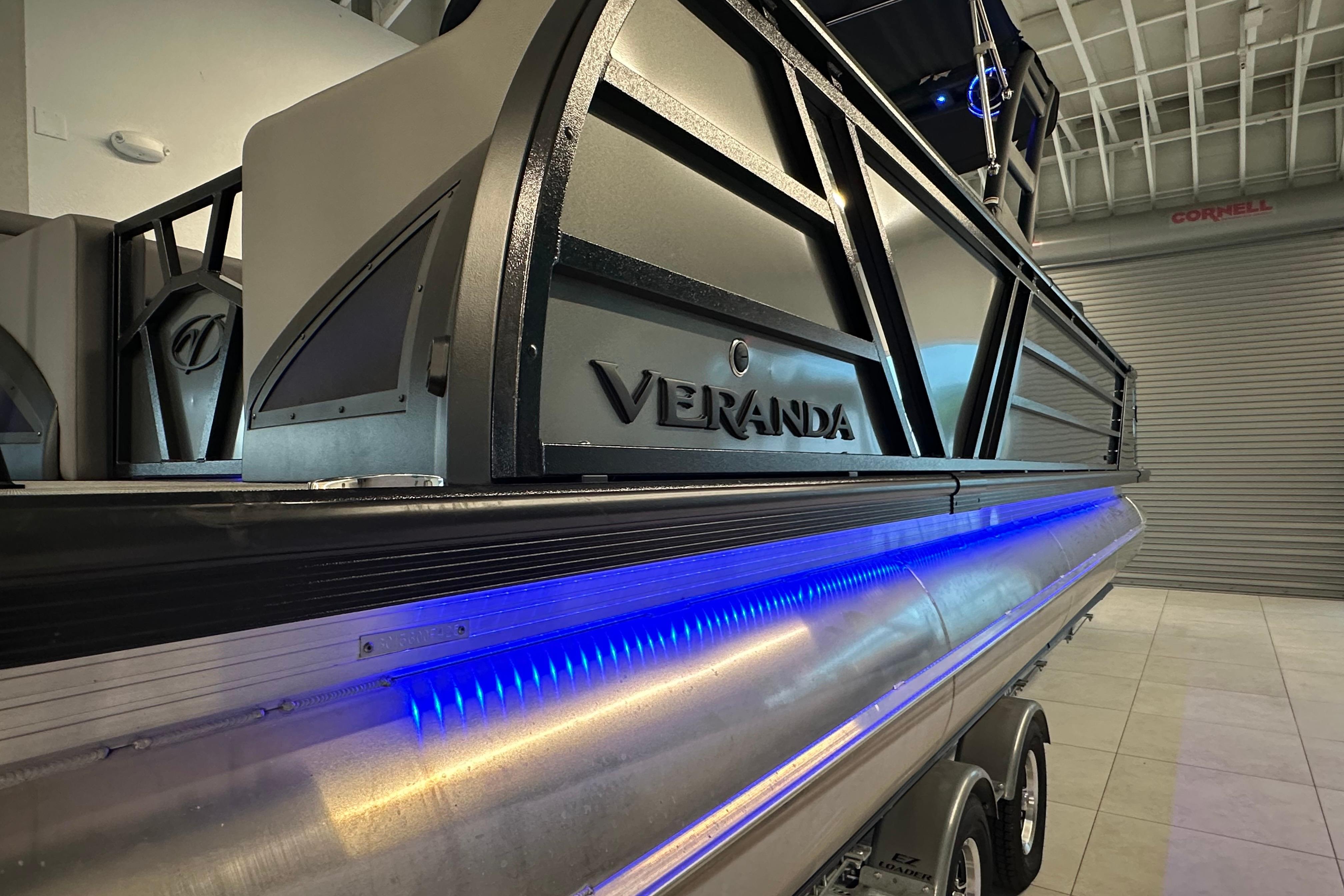 2025 Veranda VX 27 DCRC pontoon boat with sleek design and blue LED lighting.