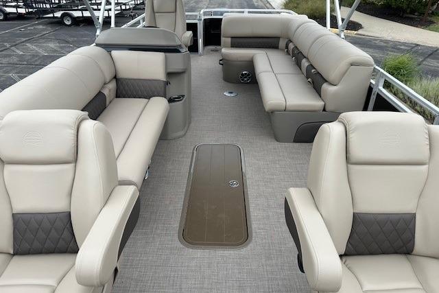 2025 Sun Tracker Sportfish 24 XP3 pontoon boat interior with beige seating and spacious layout.