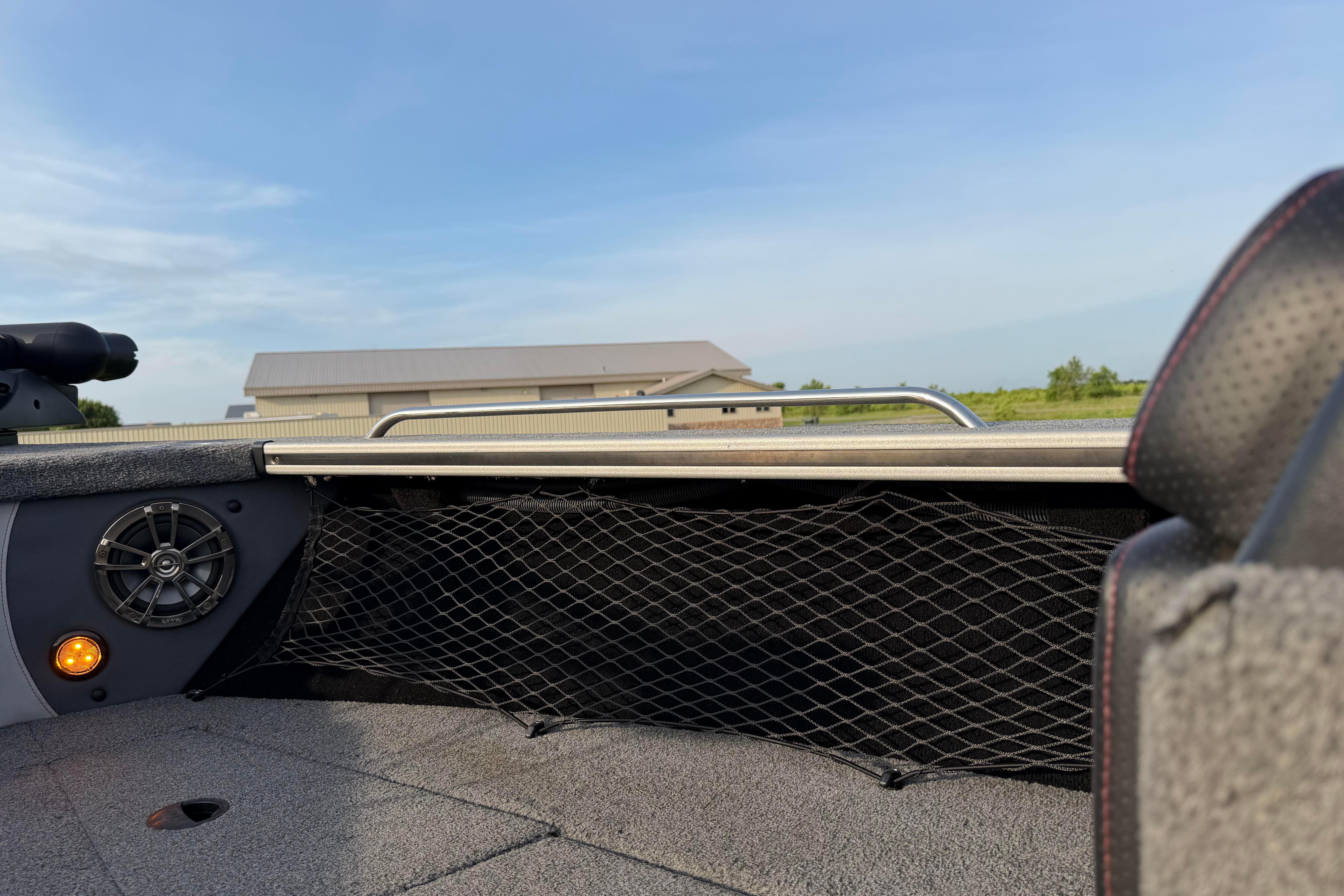 2019 Alumacraft Trophy 205 boat interior with speaker and net storage, under clear sky.