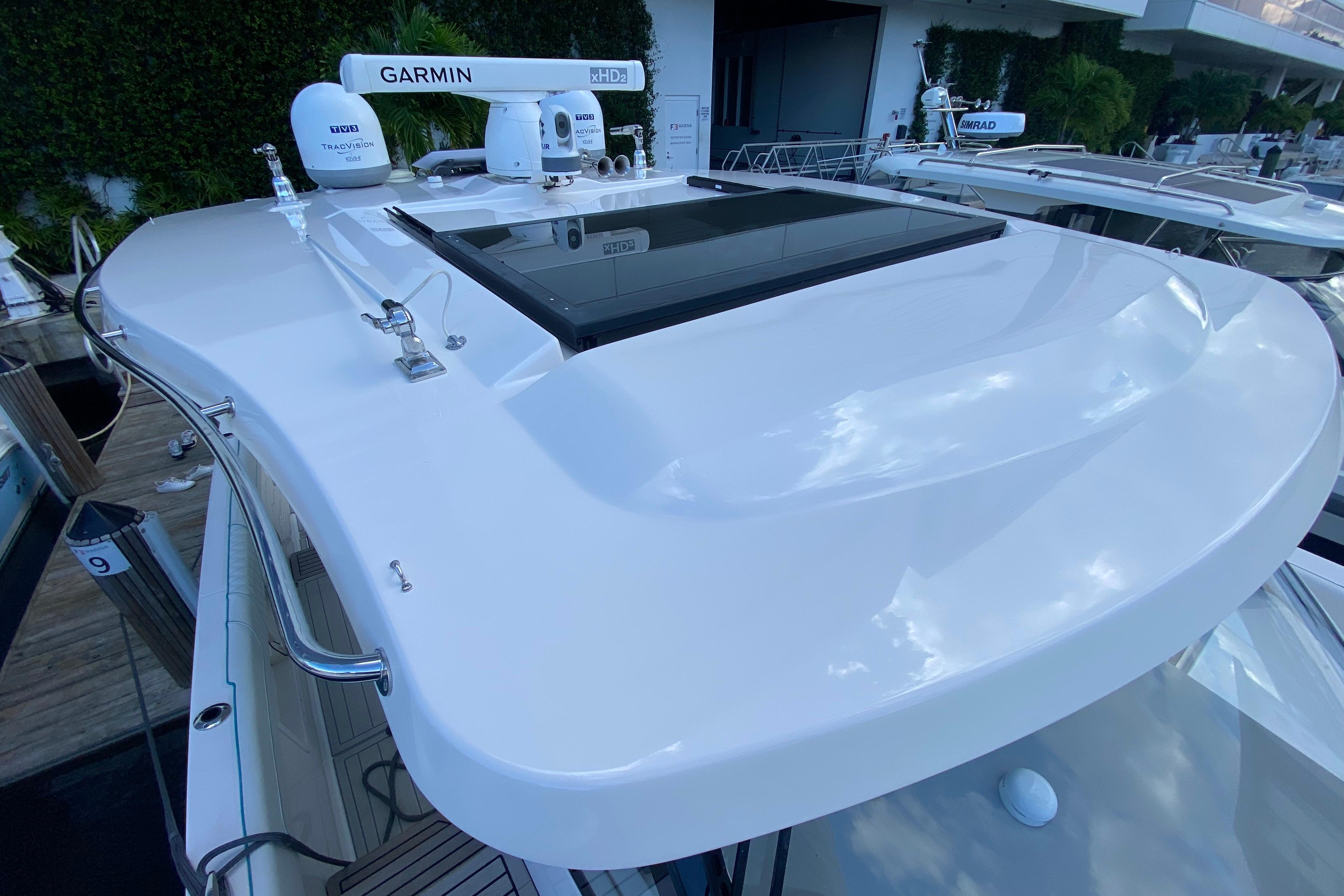 2021 Regal 38 SAV yacht with Garmin radar and sleek white design.