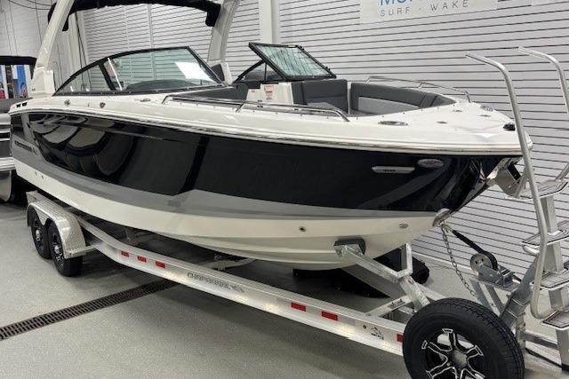 2026 Chaparral SSX 8 boat on trailer in showroom setting.