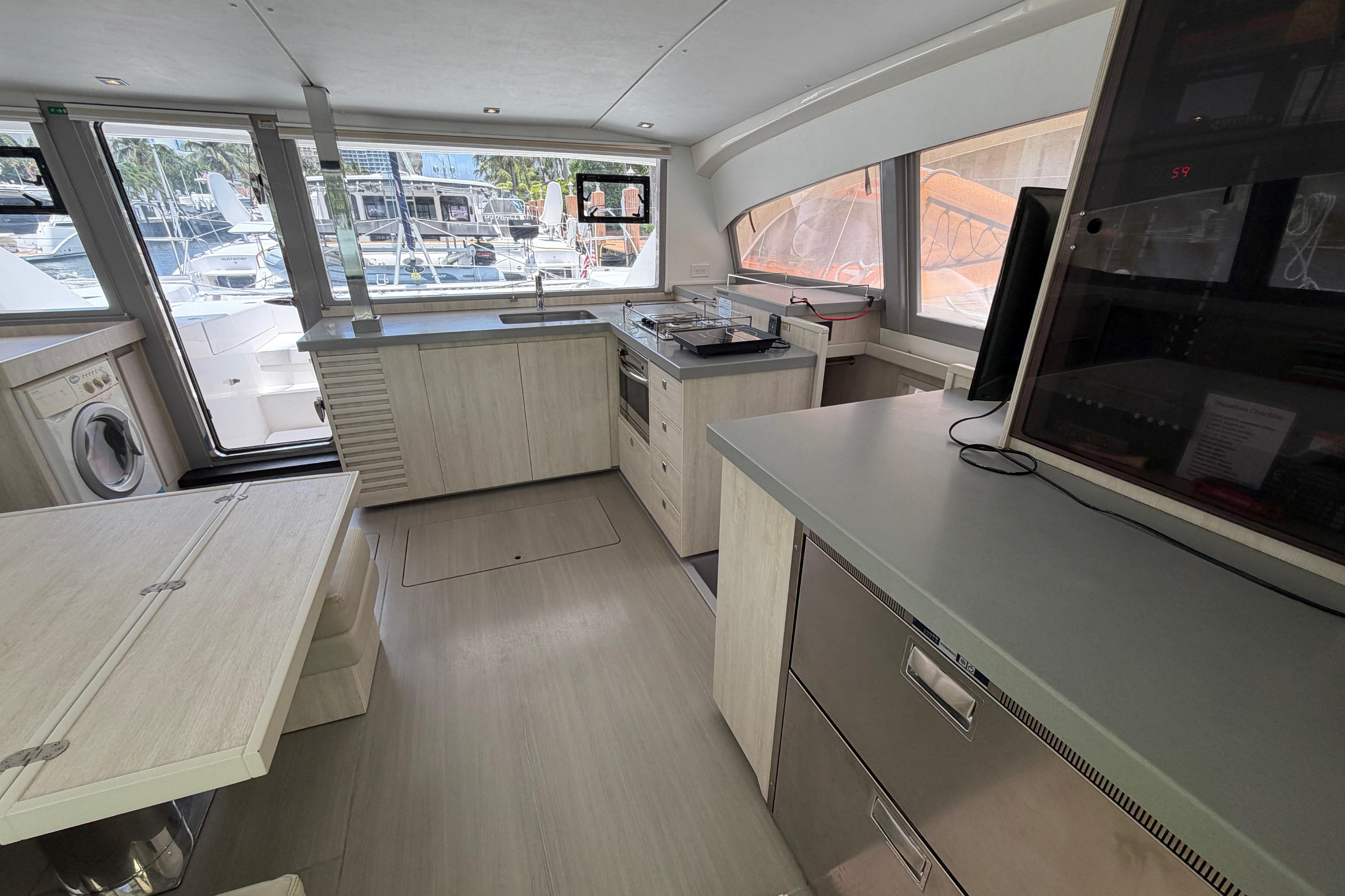 Modern kitchen interior on a 2020 Leopard 40 yacht, featuring sleek cabinetry and appliances.