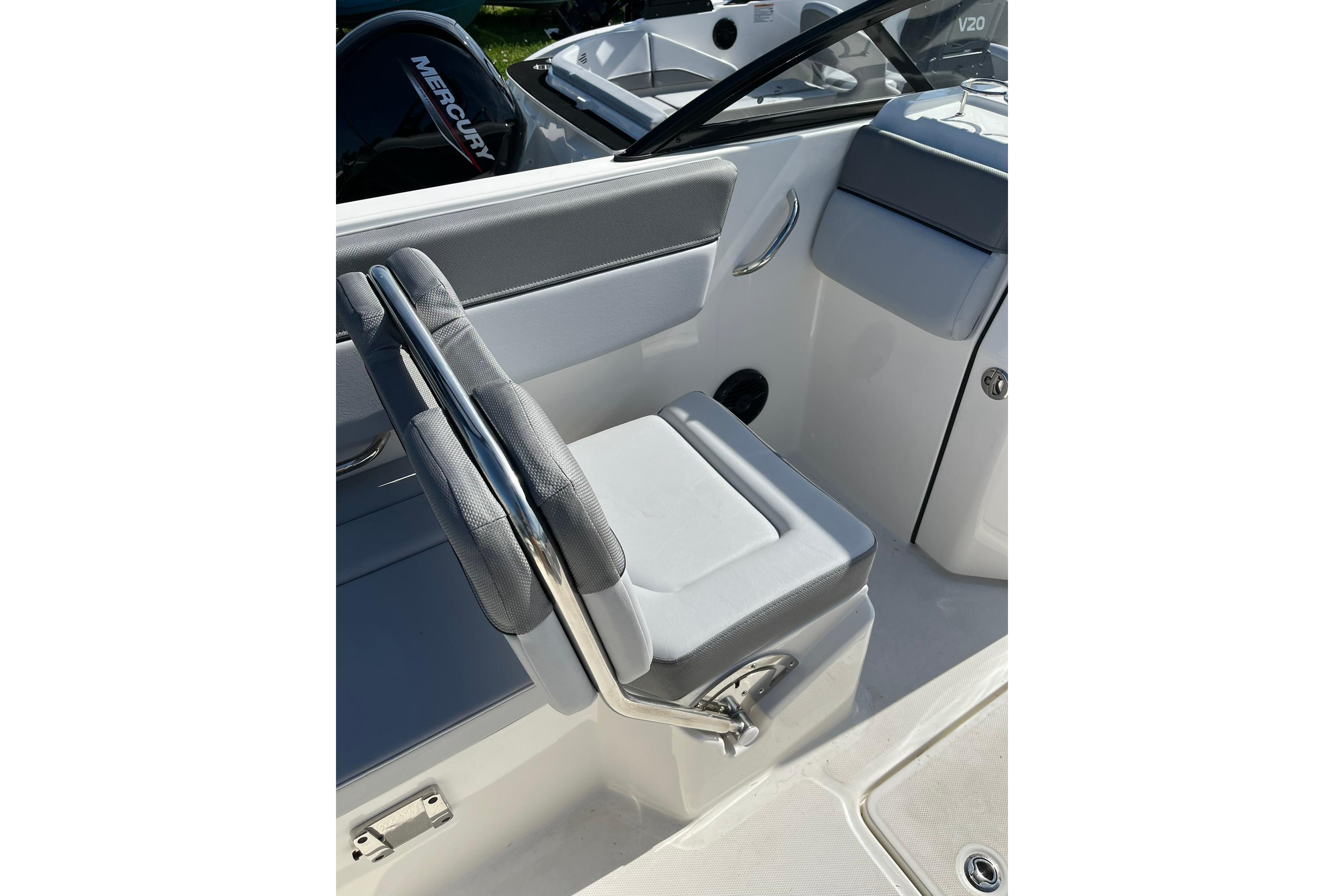 2026 Bayliner D22 boat interior with gray seating and chrome accents.