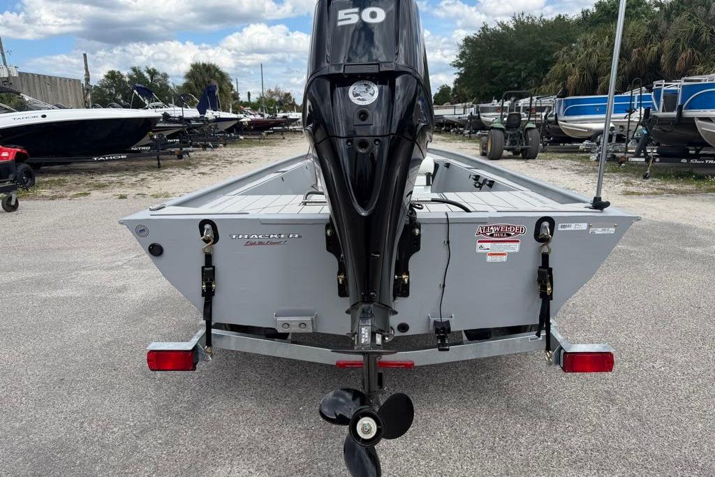 2026 Tracker Bass Tracker Classic CC boat with outboard motor, parked on a trailer.