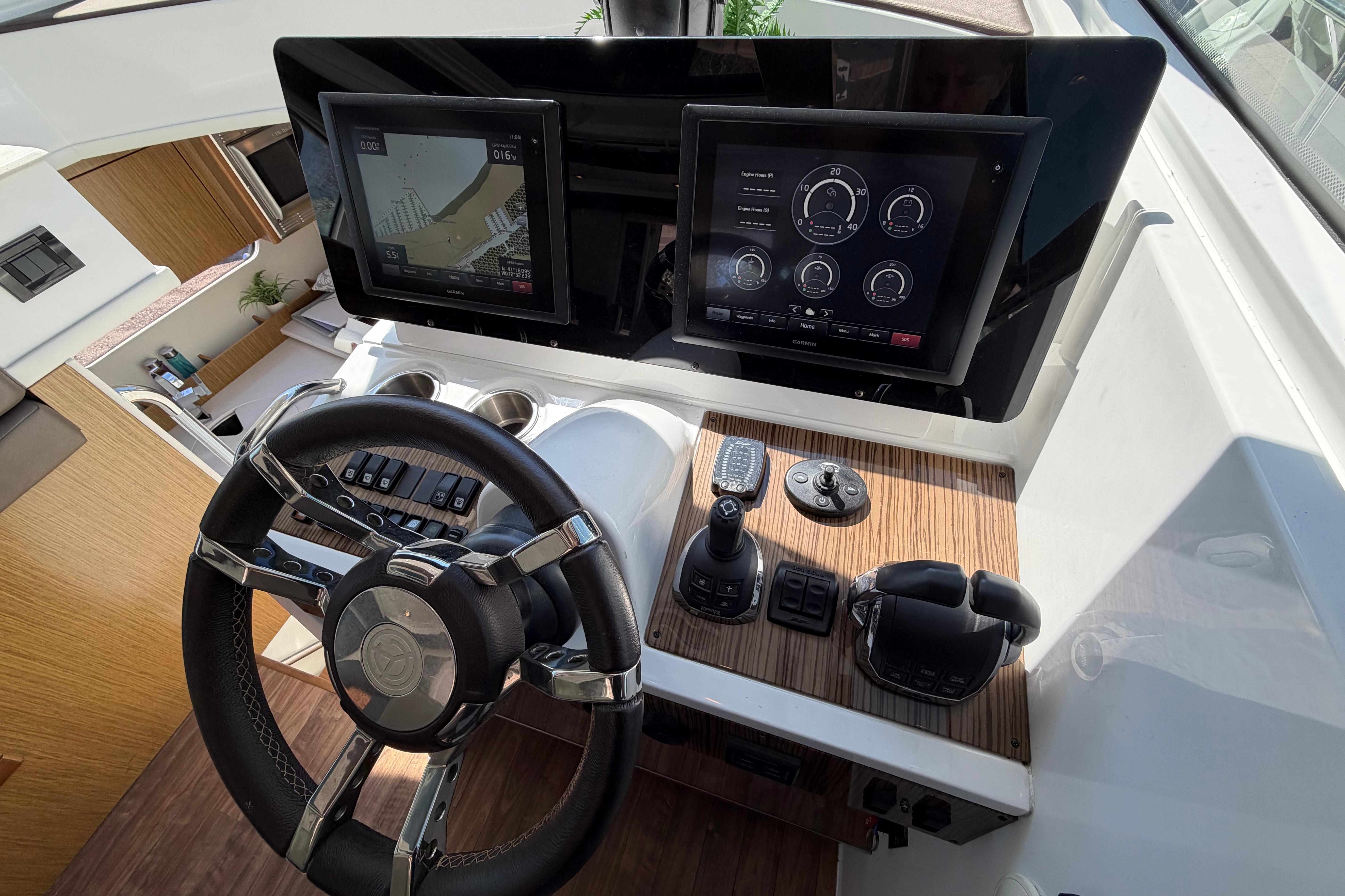 Helm of 2016 Cruisers Yachts 41 Cantius with dual displays and controls.