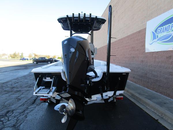 2025 Sea Pro 230 Bay boat, rear view, parked outdoors.