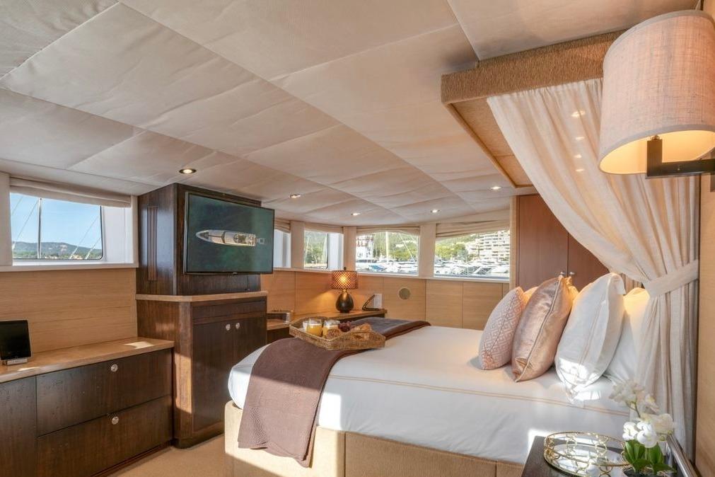 Luxurious interior of 1996 Lurssen Custom yacht with elegant bedroom decor.
