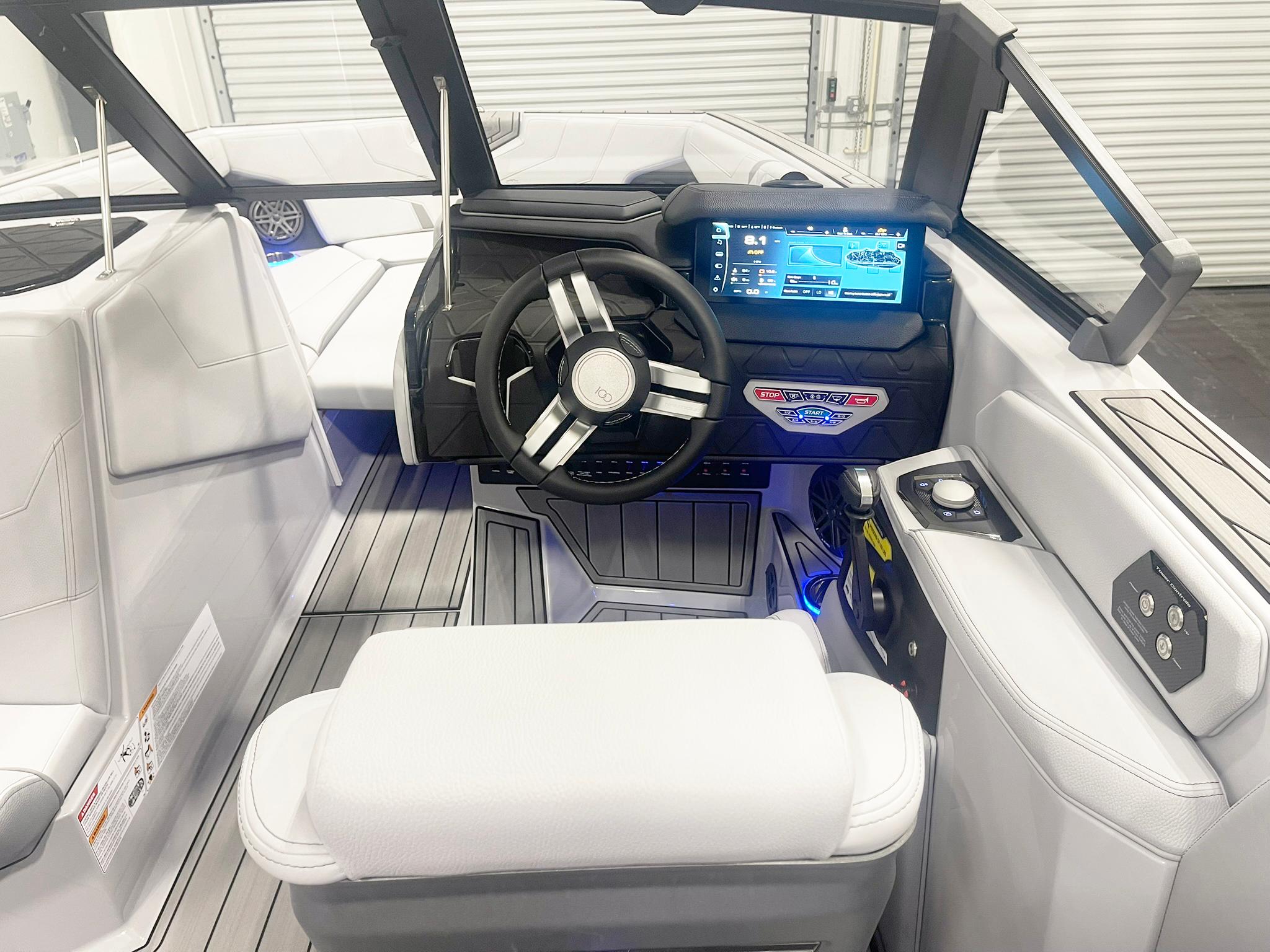 Interior of 2025 Nautique Super Air Nautique GS24 boat with modern dashboard and steering wheel.