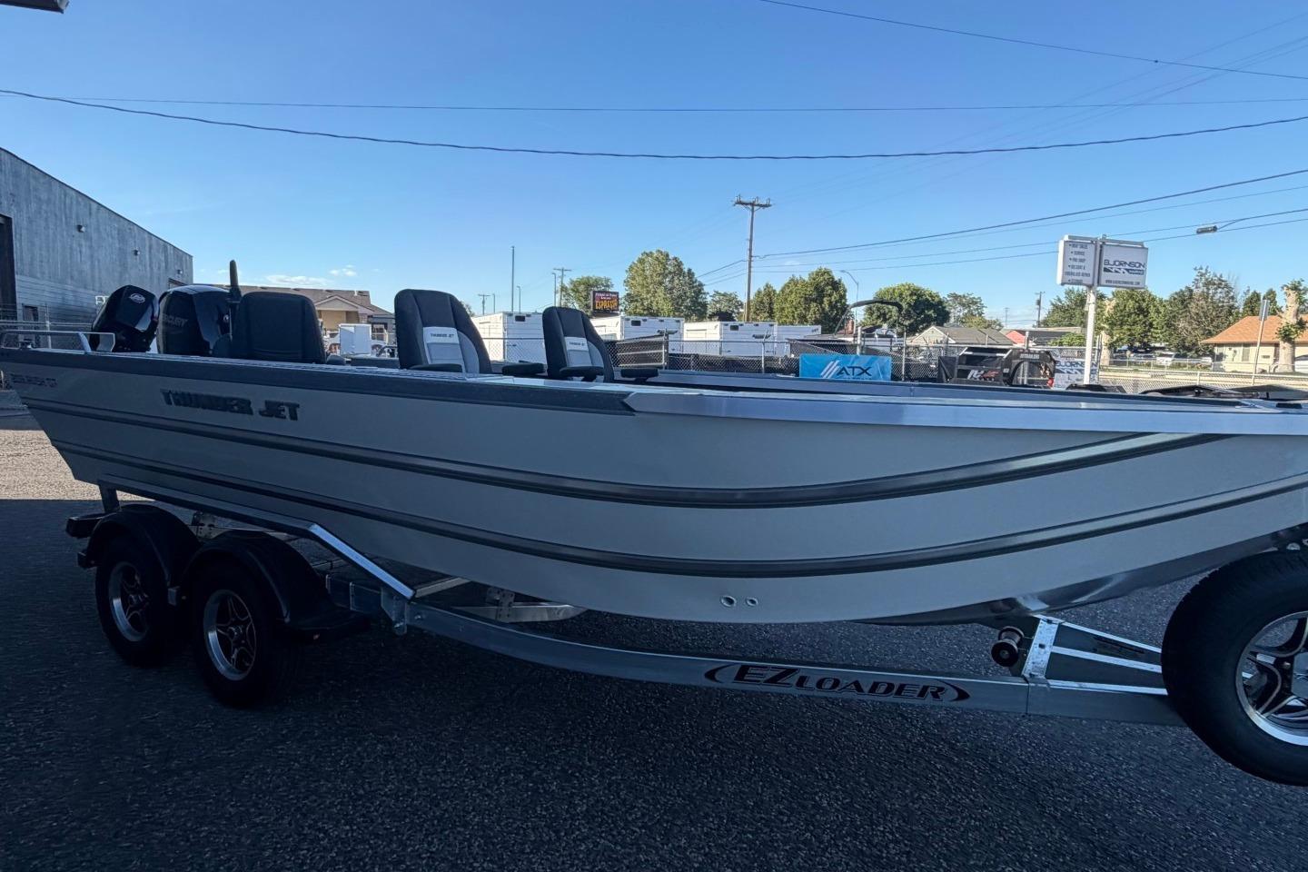 2026 Thunder Jet 209 Rush OT boat on trailer in outdoor setting.