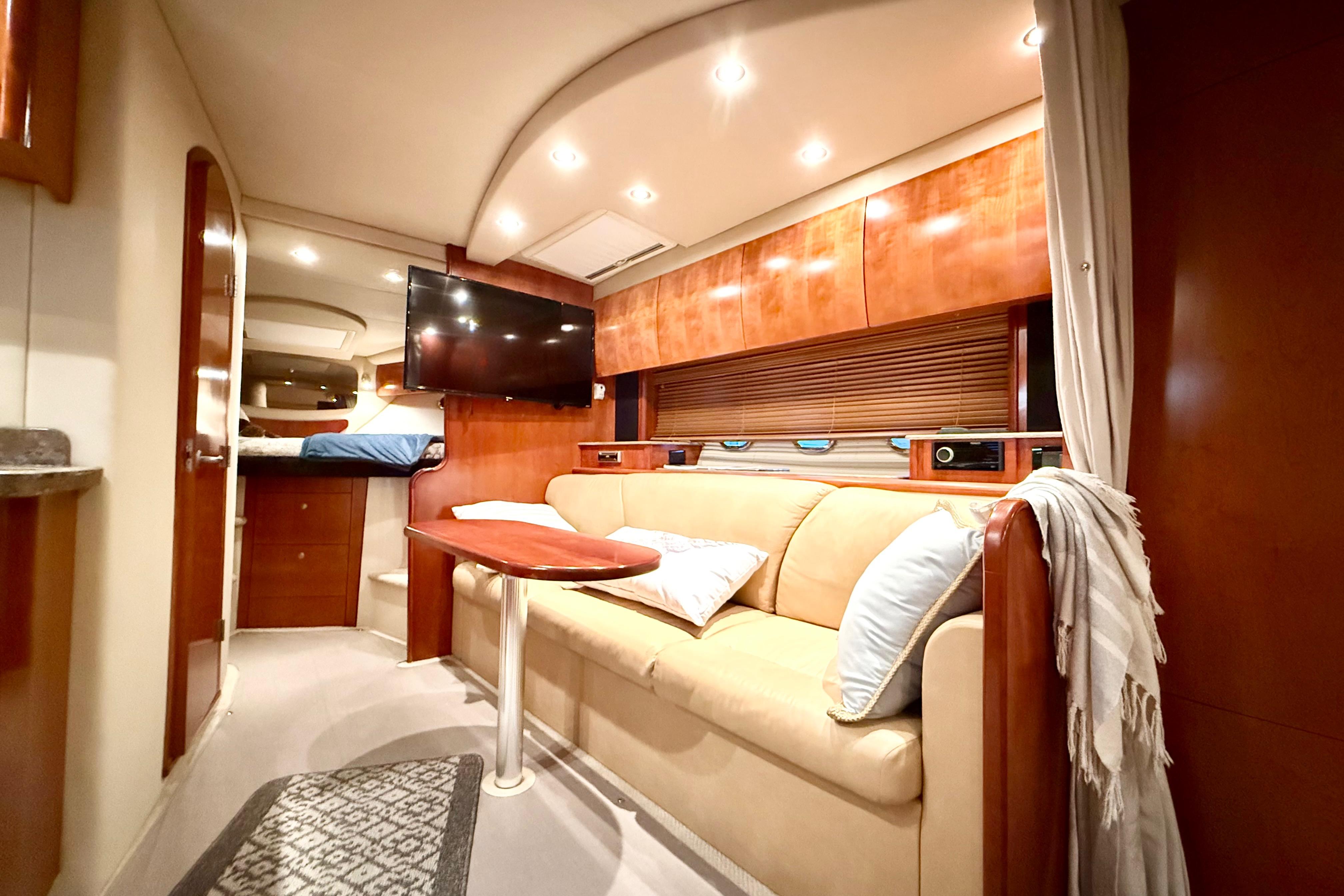 Luxurious interior of 2011 Cruisers Yachts 390 Sports Coupe with cozy seating and modern amenities.