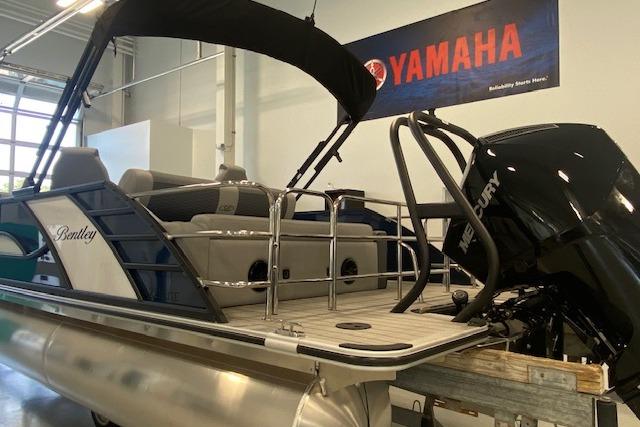 2026 Bentley Pontoons Elite 223 Swingback with Mercury engine in showroom.