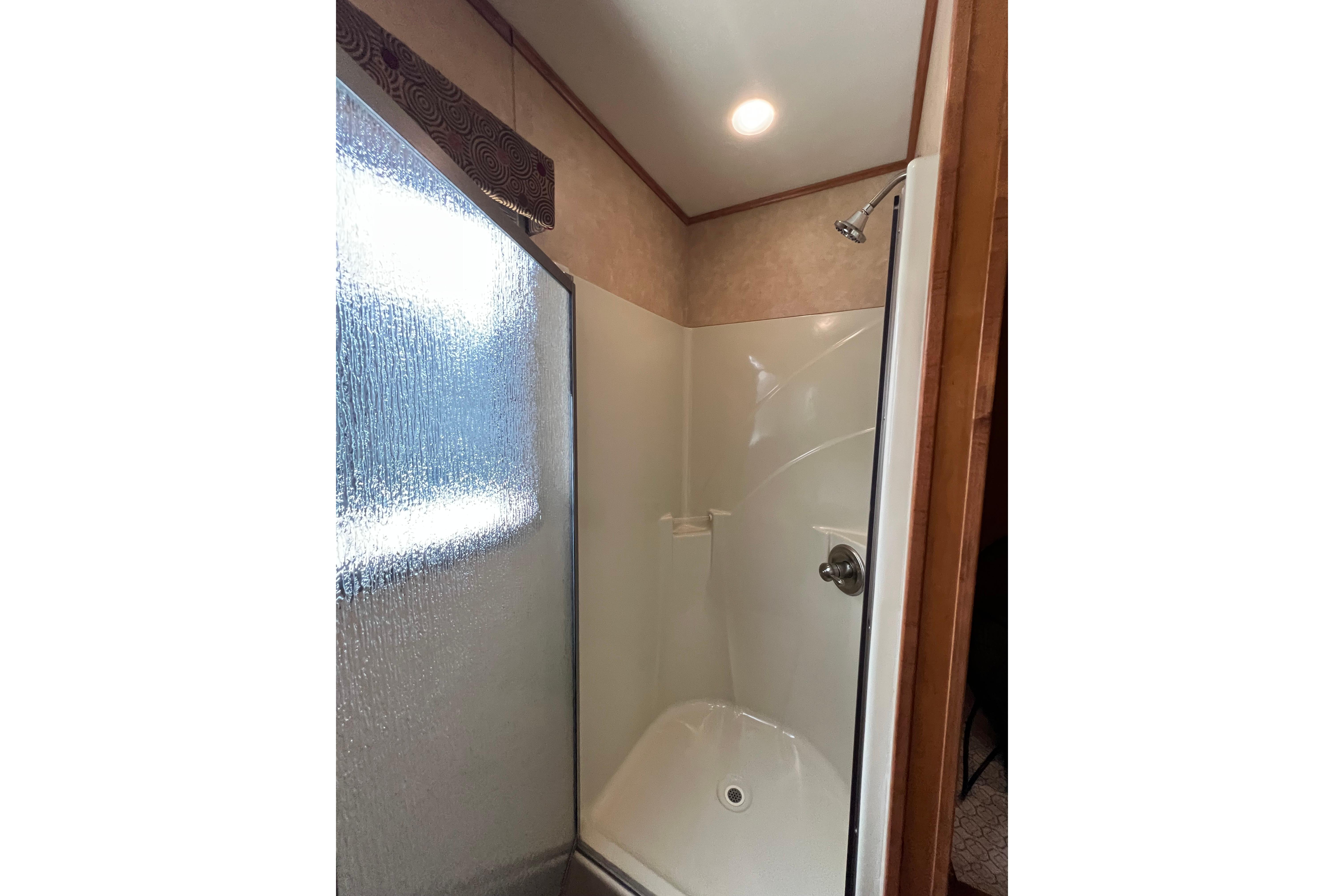 Shower area in 2013 Destination Yacht Lotta Yachta with frosted glass door.