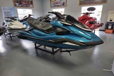 2026 Yamaha WaveRunner FX Cruiser SVHO in showroom, sleek blue design.