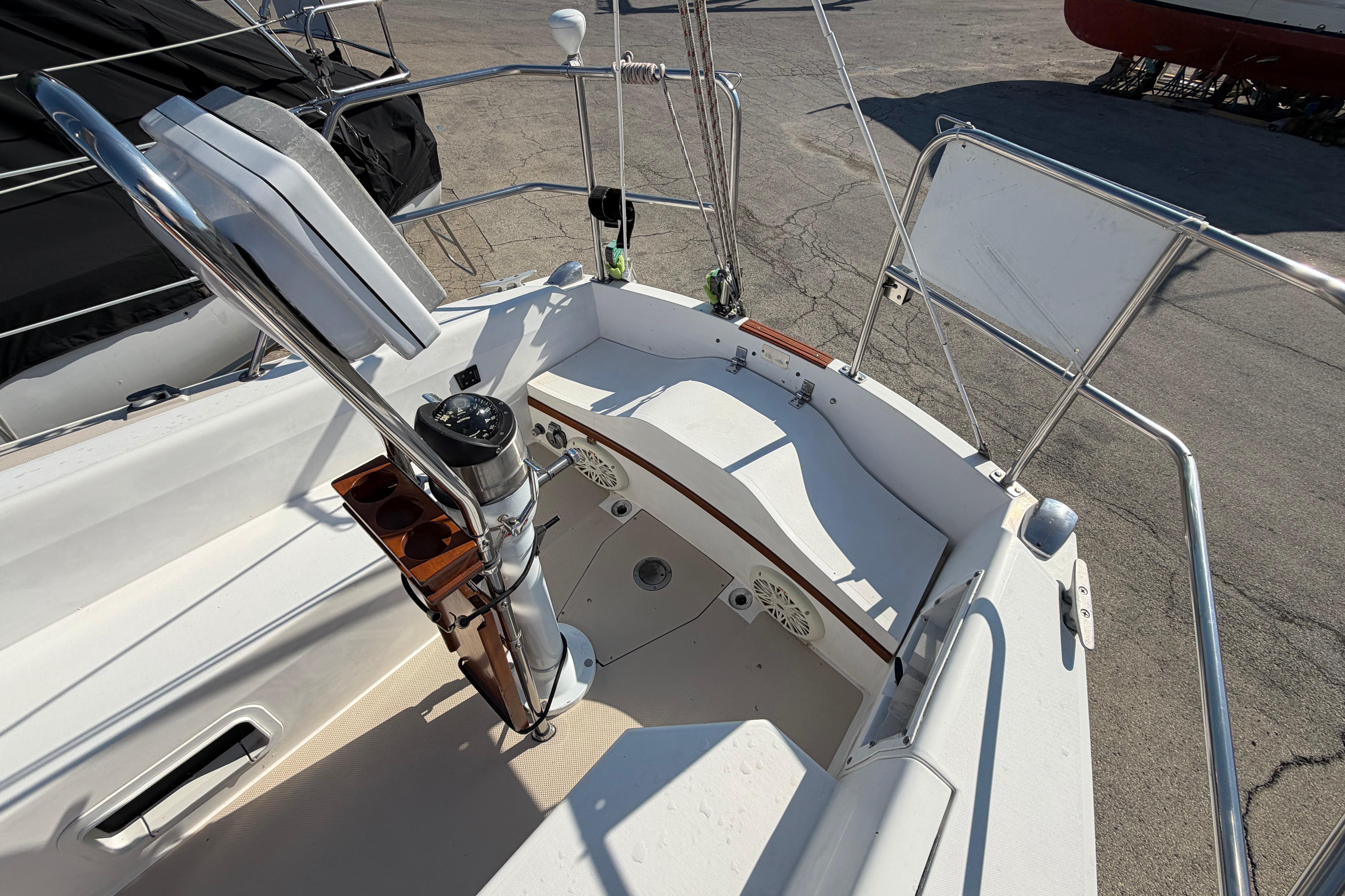 Cockpit of 1988 Catalina 30 MkII sailboat with steering wheel and navigation instruments.