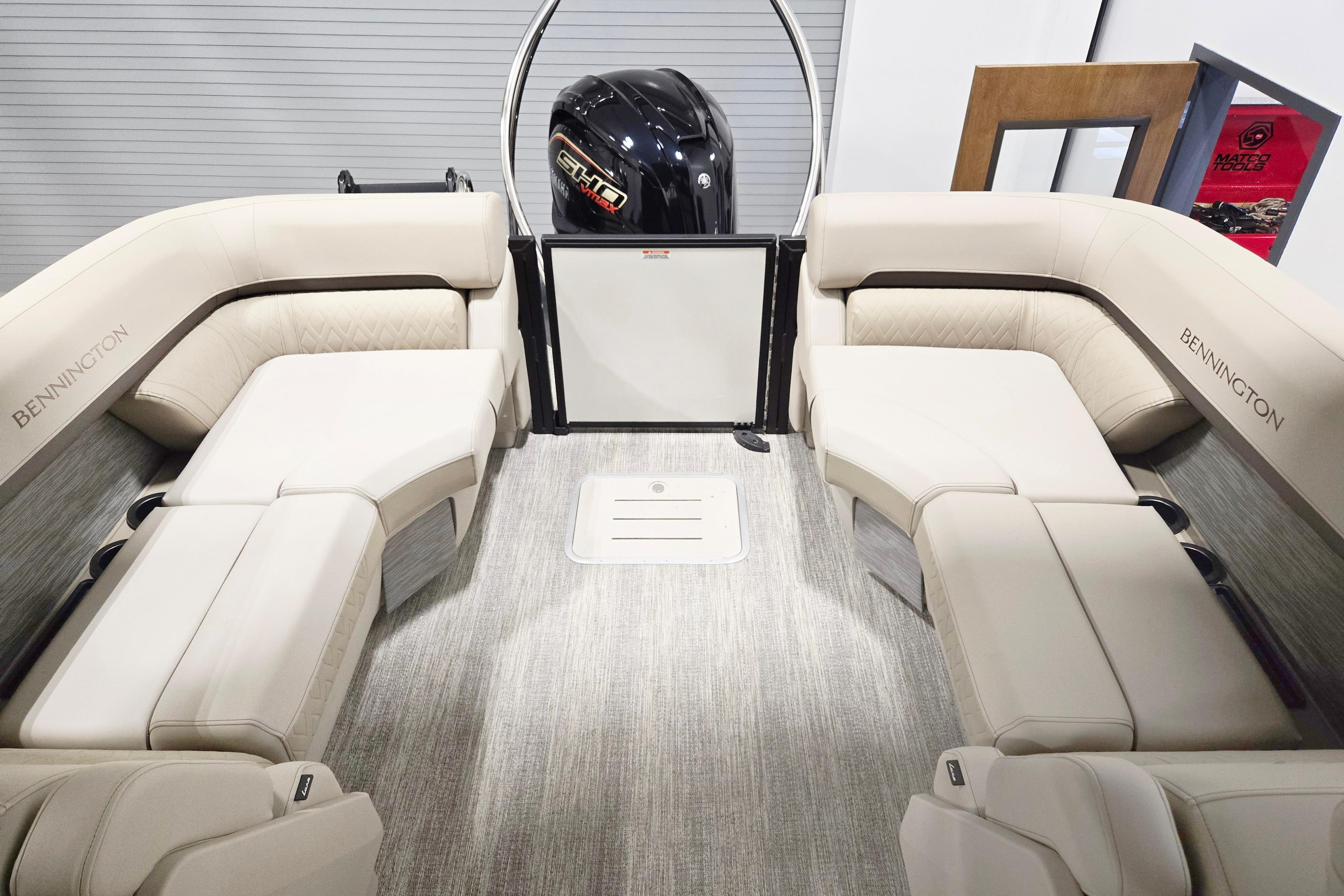 Luxurious interior of 2026 Bennington 24 M pontoon boat with plush seating.