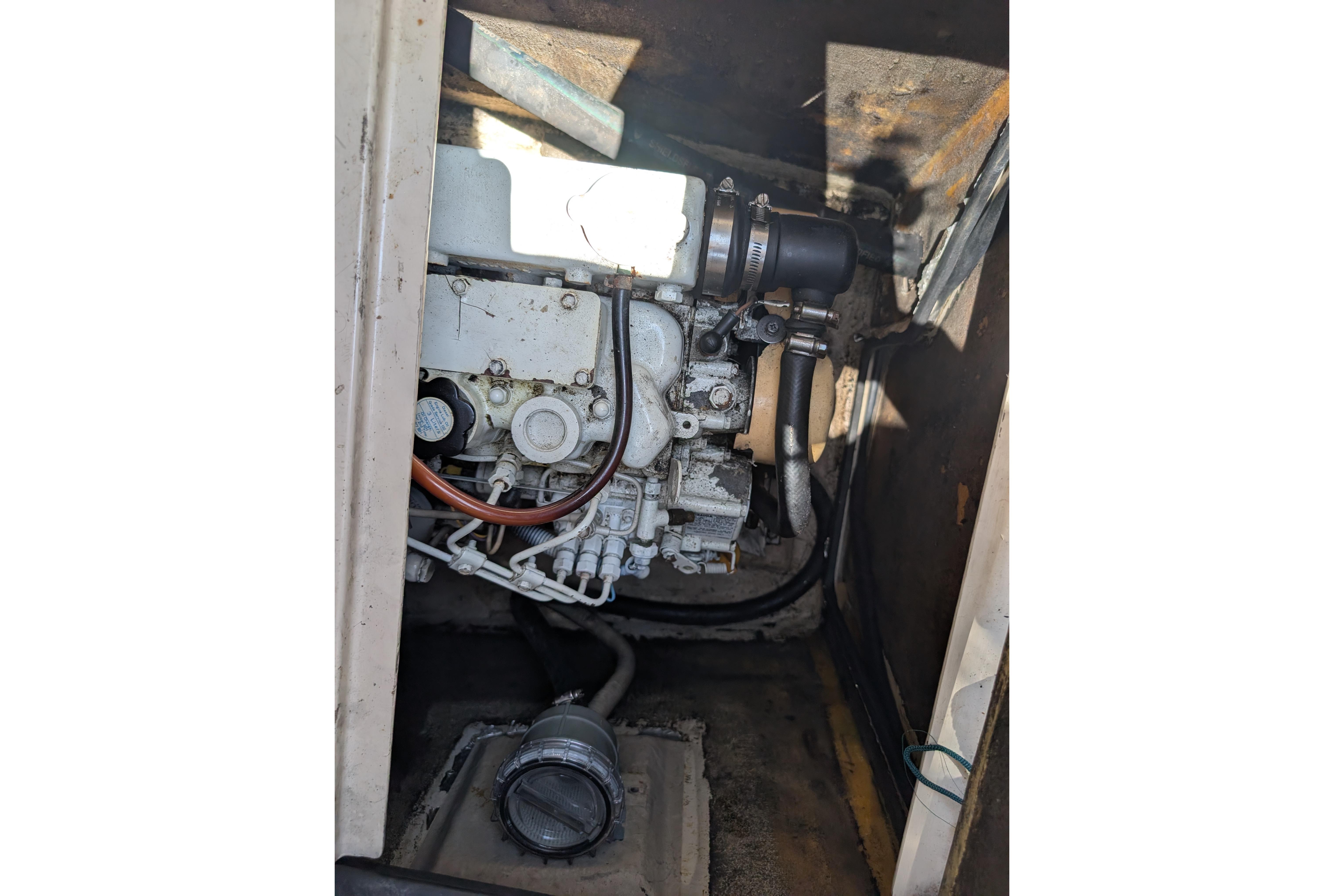 Engine compartment of 2004 PDQ 34 Powercat, showcasing mechanical components and wiring.