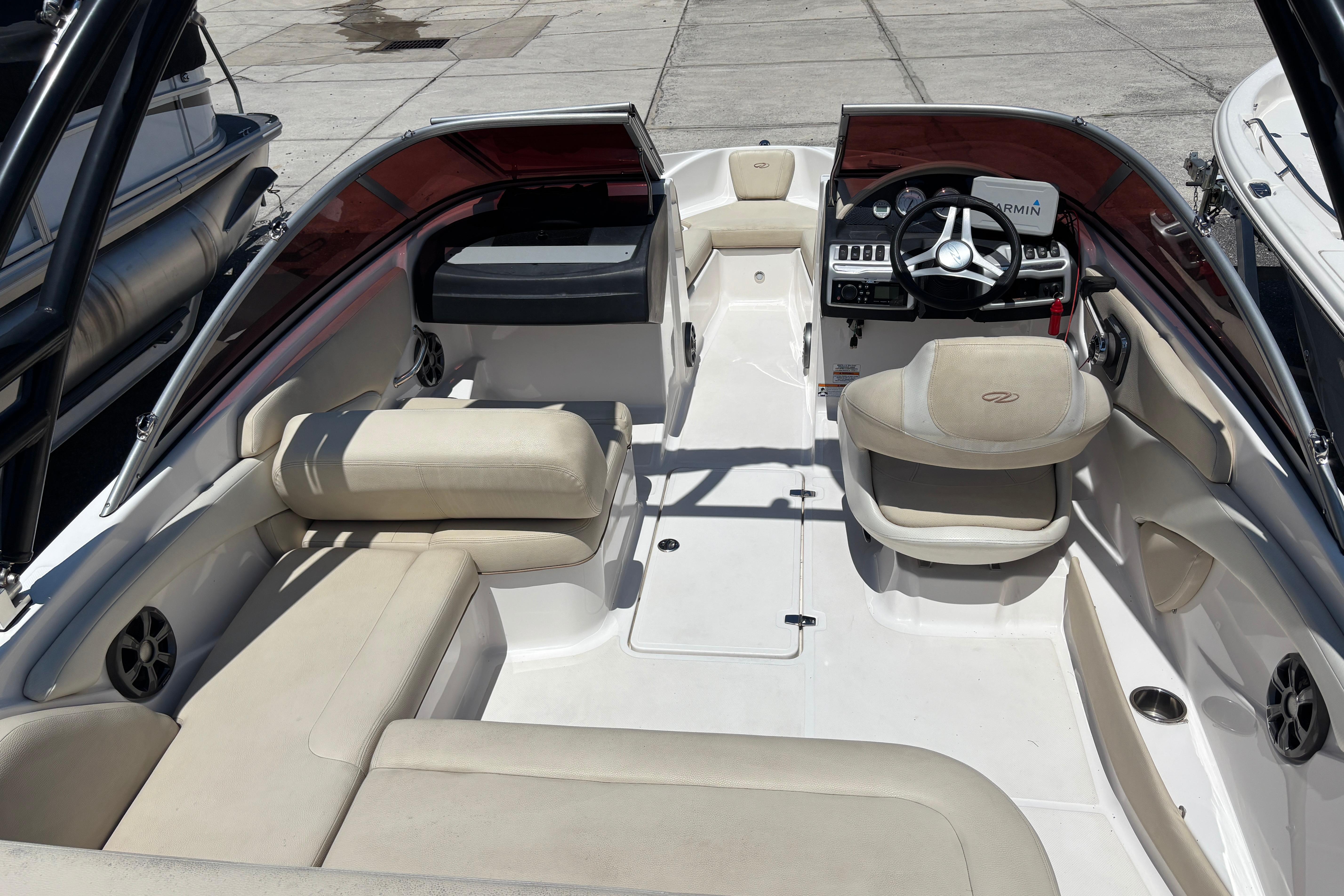 2018 Regal 1900 ES Bowrider interior with beige seating and modern dashboard.
