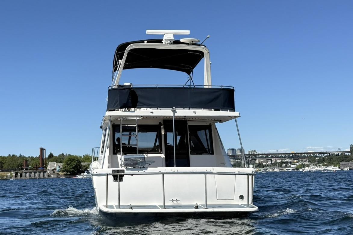 1997 Bayliner 3988 Command Bridge Motoryacht cruising on a sunny day.