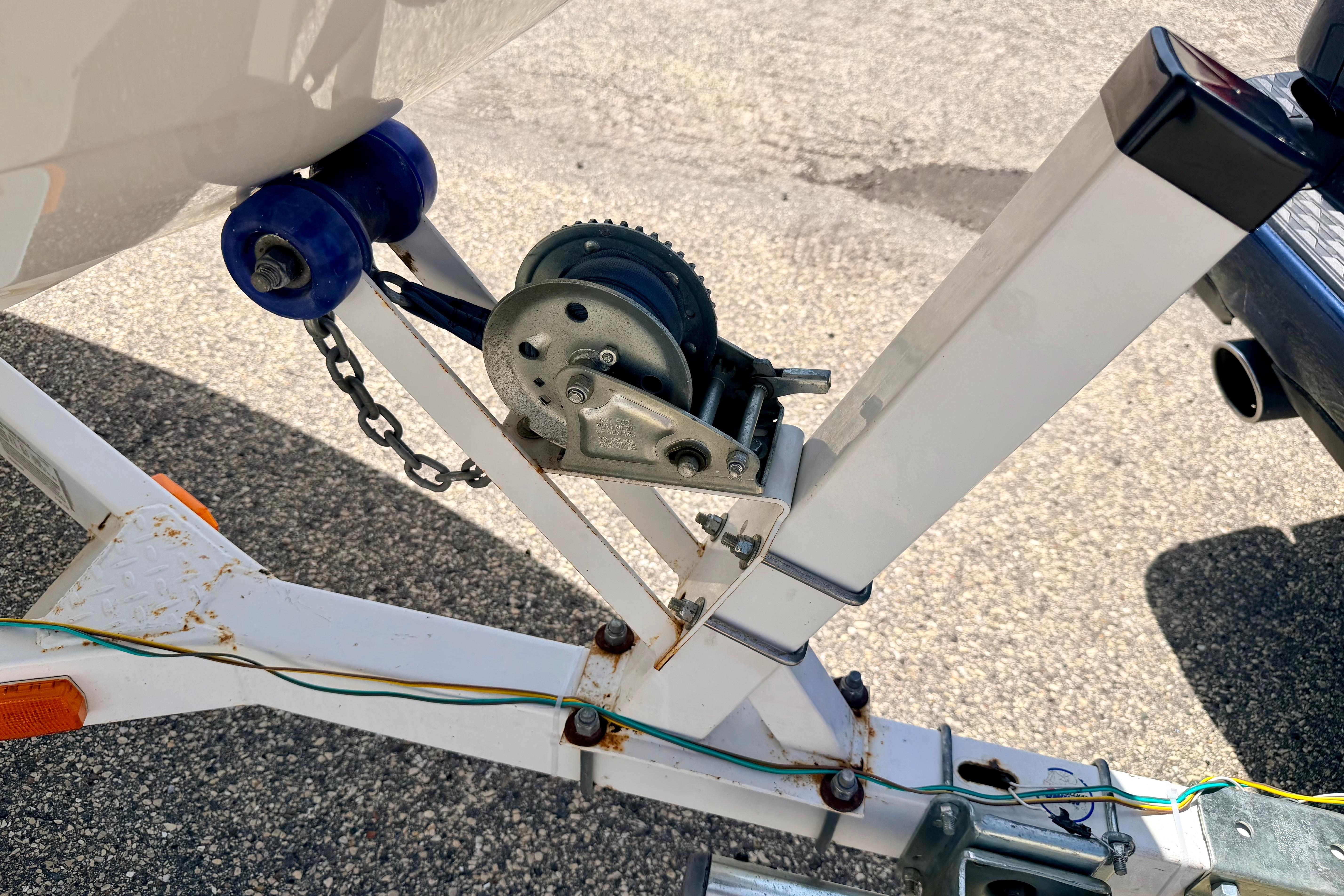 Trailer winch mechanism for 2004 Bombardier SEADOO Utopia 185 boat, featuring blue rollers.