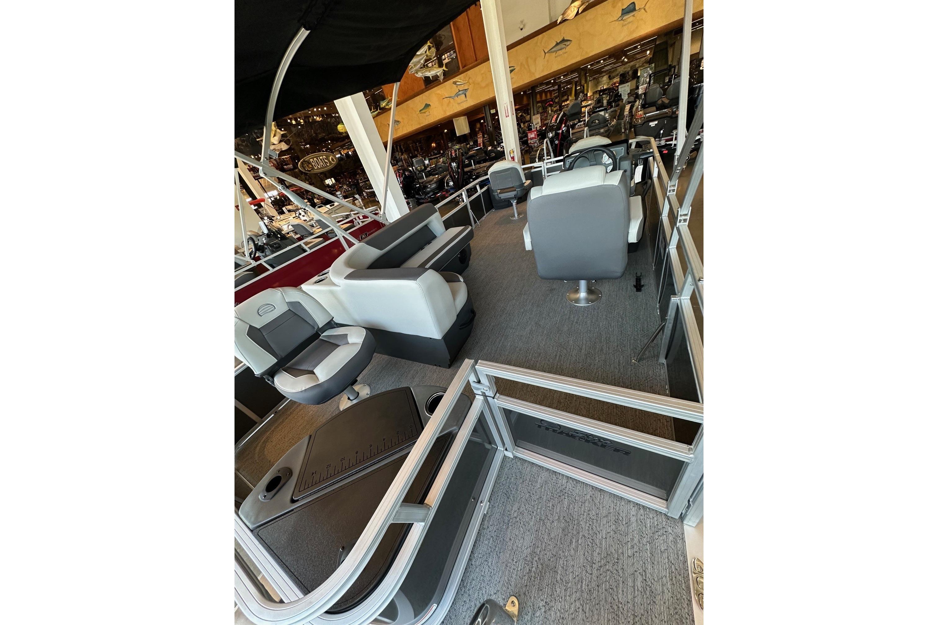 2026 Sun Tracker Bass Buggy 18 DLX pontoon boat interior with seating and helm.